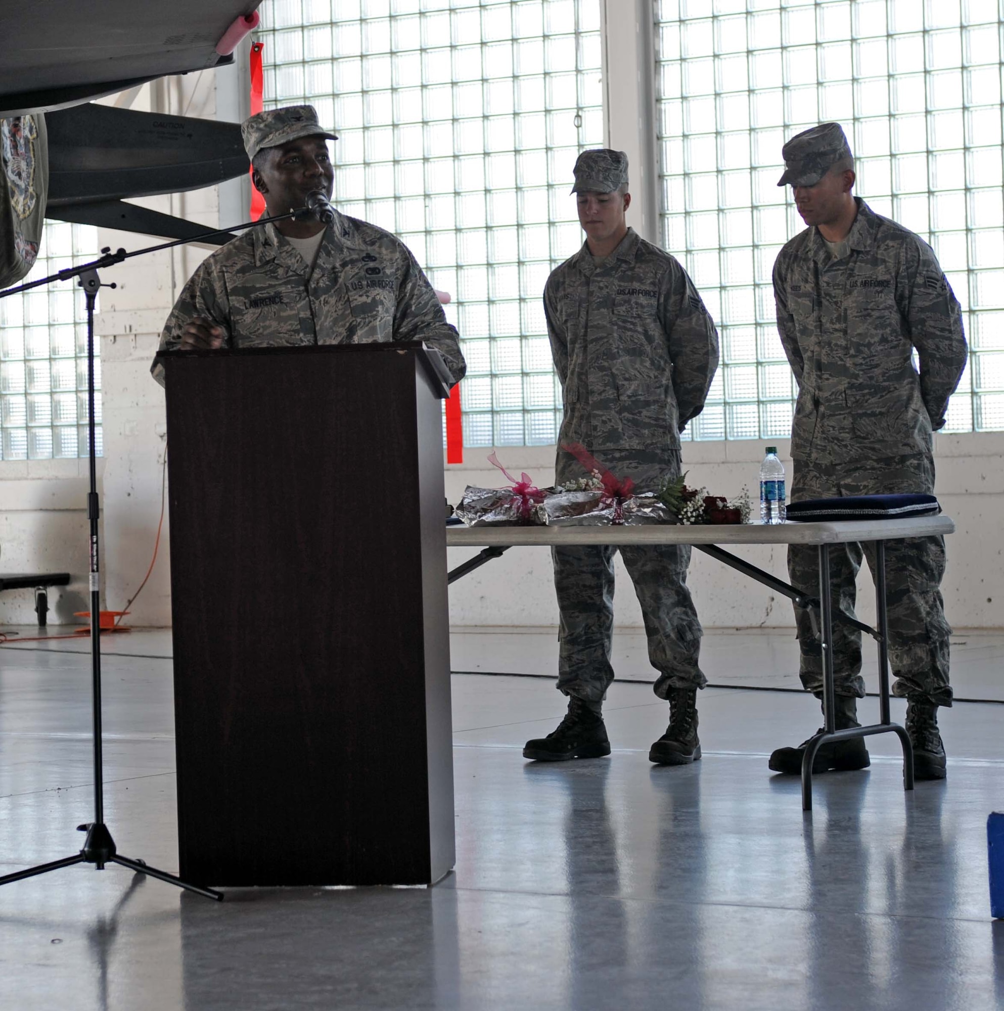 U.S. Air Force Col. Michael Lawrence, 366th Maintenance Group commander, speaks to personnel from his group and fellow Gunfighters July 22, 2013, at Mountain Home Air Force Base, Idaho. Lawrence commands an organization comprised of more than 1,900 personnel. (U.S. Air Force photo by Senior Airman Benjamin Sutton)