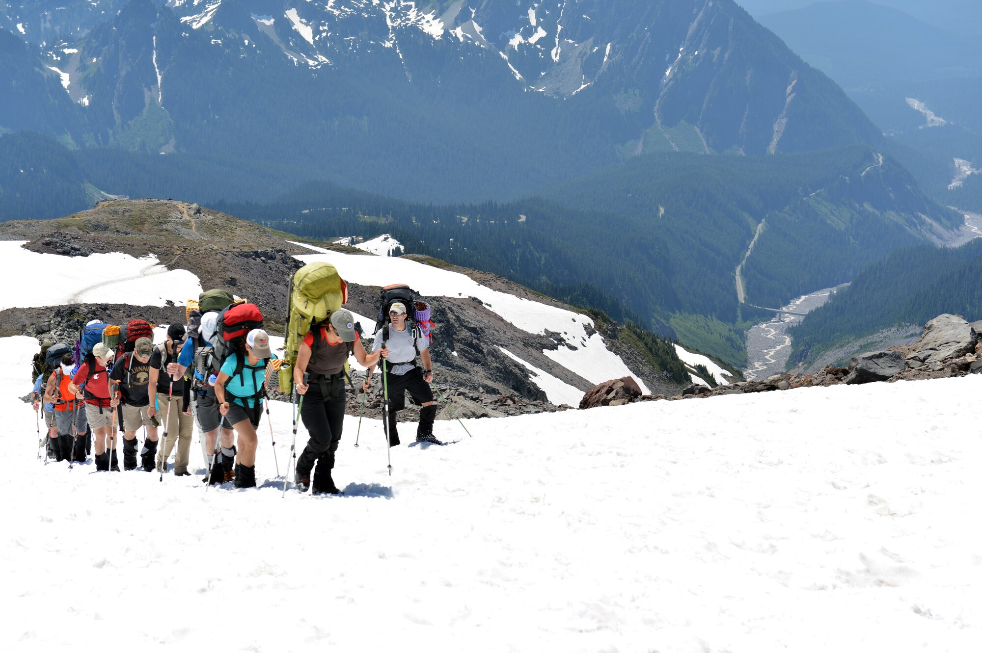 Maj. Mark Uberuaga, 88th Test and Evaluations Squadron pilot, team leader for the “Climbing for Warriors,” instructs climbers of proper footing techniques as the group ascends the Muir Snow Field, July 20, 2013 at Mount Rainier, Wash. Uberuaga is a native of Ashford, Wash., and grew up climbing Mount Rainier. (U.S. Air Force photo/Staff Sgt. Jason Truskowski)