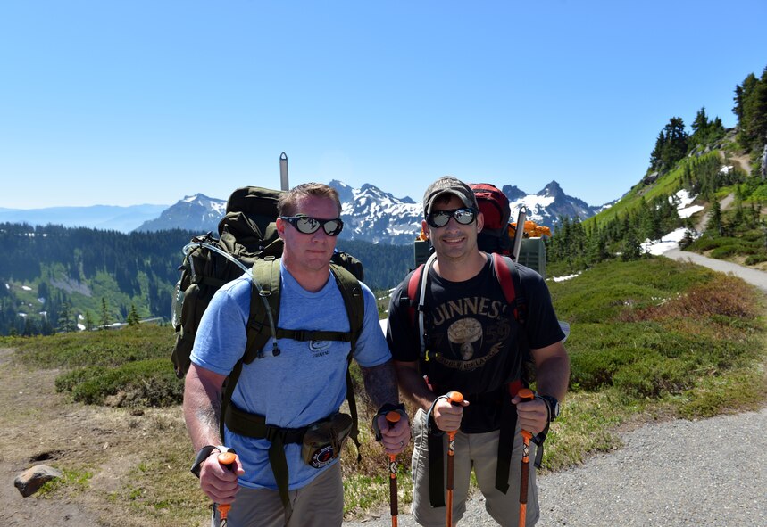 Master Sgt. Doug Neville and Staff Sgt. Brian Wadtke, 22nd Special Tactics Squadron combat controllers, pose for a photo during a rest stop on the way to Camp Muir, July 20, 2013. Neville and Wadtke are the first Airmen to climb with the U.S. Air Force Seven Summits Team as part of their new “Climbing for Warriors” program. (U.S. Air Force photo/Staff Sgt. Jason Truskowski)