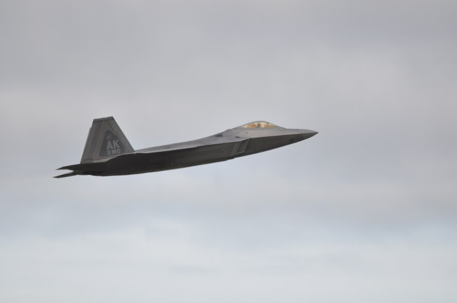 An F-22 assigned to the 3rd Wing takes off to participate in a Turkey Shoot here July 17. Pilots from the 302nd, 90th and 525th Fighter Squadrons flew the F-22 during a three day competition testing their ability to perform in real world combat situations. (U.S. Air Force Photo/Tech. Sgt. Dana Rosso)