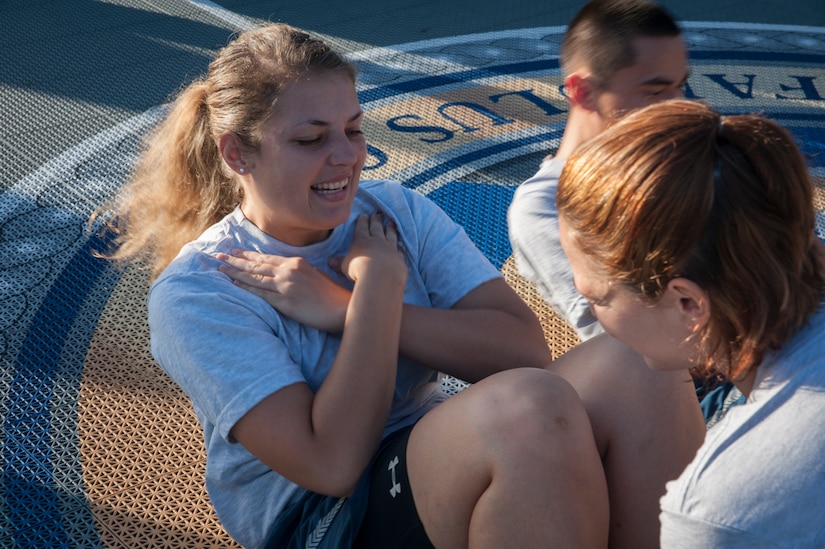 Airman 1st Class Katherine Stanton, 15th Airlift Squadron loadmaster, performs sit-ups July 19, 2013, at the Dorm Challenge at Joint Base Charleston - Air Base, S.C. The quarterly competition is a Wing initiative intended to encourage resident interaction and camaraderie as part of Comprehensive Airman Fitness.  The Dorm Challenge consisted of push-ups, sit-ups, and games of corn hole and basketball. (U.S. Air Force photo/Senior Airman Ashlee Galloway)