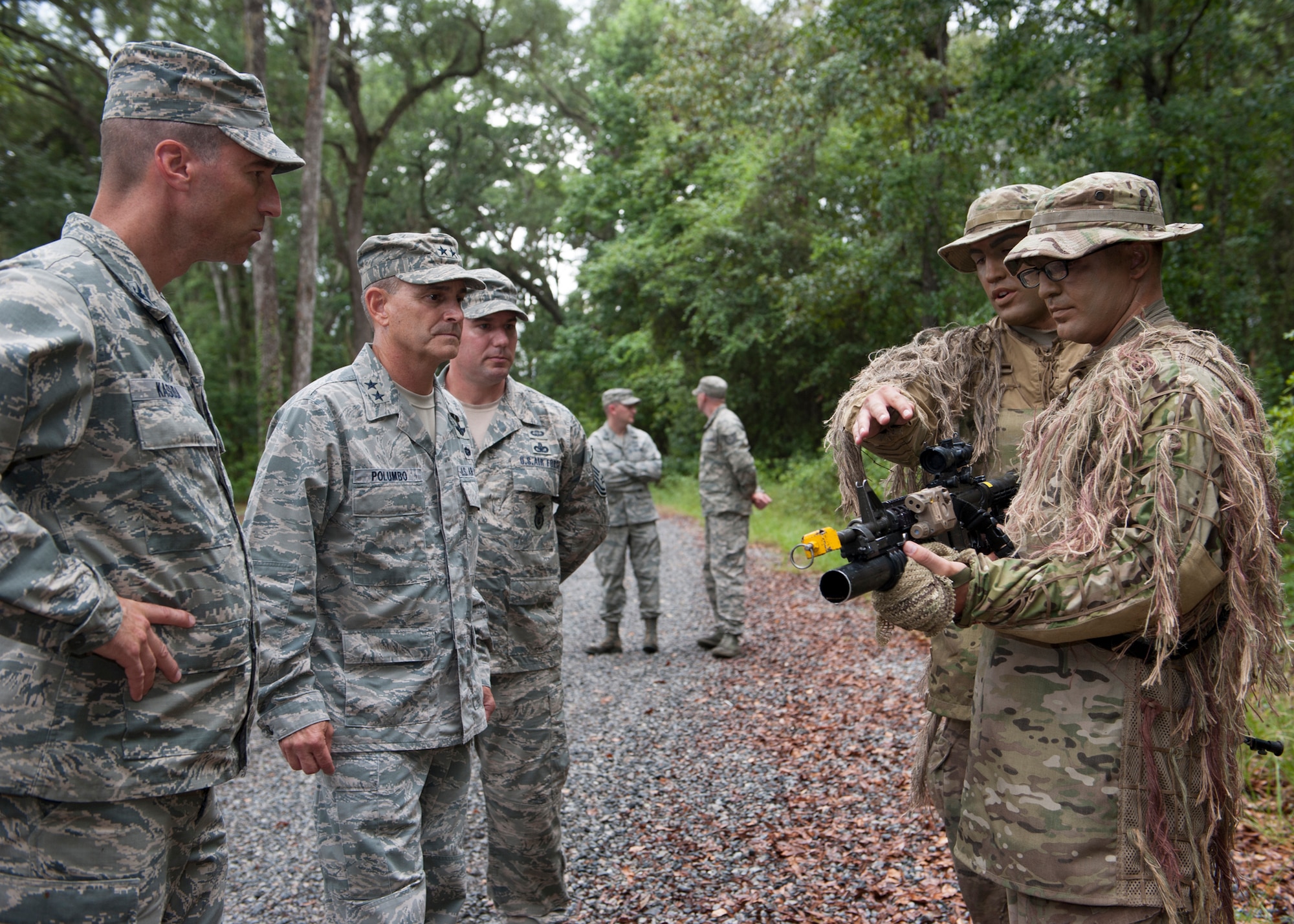 U.S. Air Force Maj. Gen. Jake Polumbo, 9th Air Force commander, speaks with close-range shooters from the 820th Base Defense Group during a training mission showcase held in the Military Operations in Urban Terrain village at Moody Air Force Base, Ga., July 19, 2013. Polumbo toured the base and met with Moody Airmen after flying in the 23d Wing’s first HC-130J Combat King II. (U.S. Air Force photo by Senior Airman Eileen Meier/Released) 