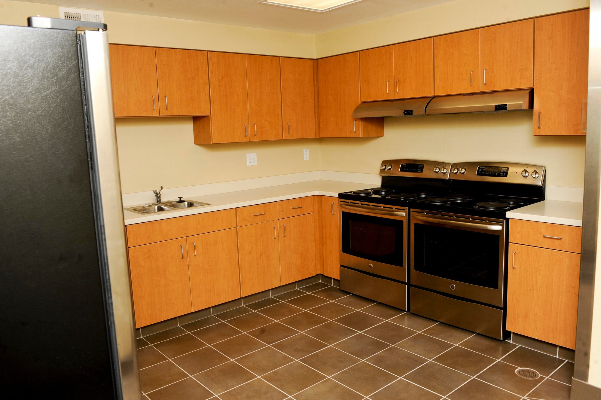 The renovation of one of the kitchenettes inside the Lincoln Hall Dormitory at Ellsworth Air Force Base, S.D, was completed on June 20, 2013. By the end of September, all dormitories will receive brand new unisex restrooms, two new stove/oven combos, a refrigerator/freezer unit, microwave, sink, dishwasher, cabinets and plenty of counter space for Airmen to utilize and cook their meals. (U.S. Air Force photo by Airman 1st Class Anania Tekurio/Released)