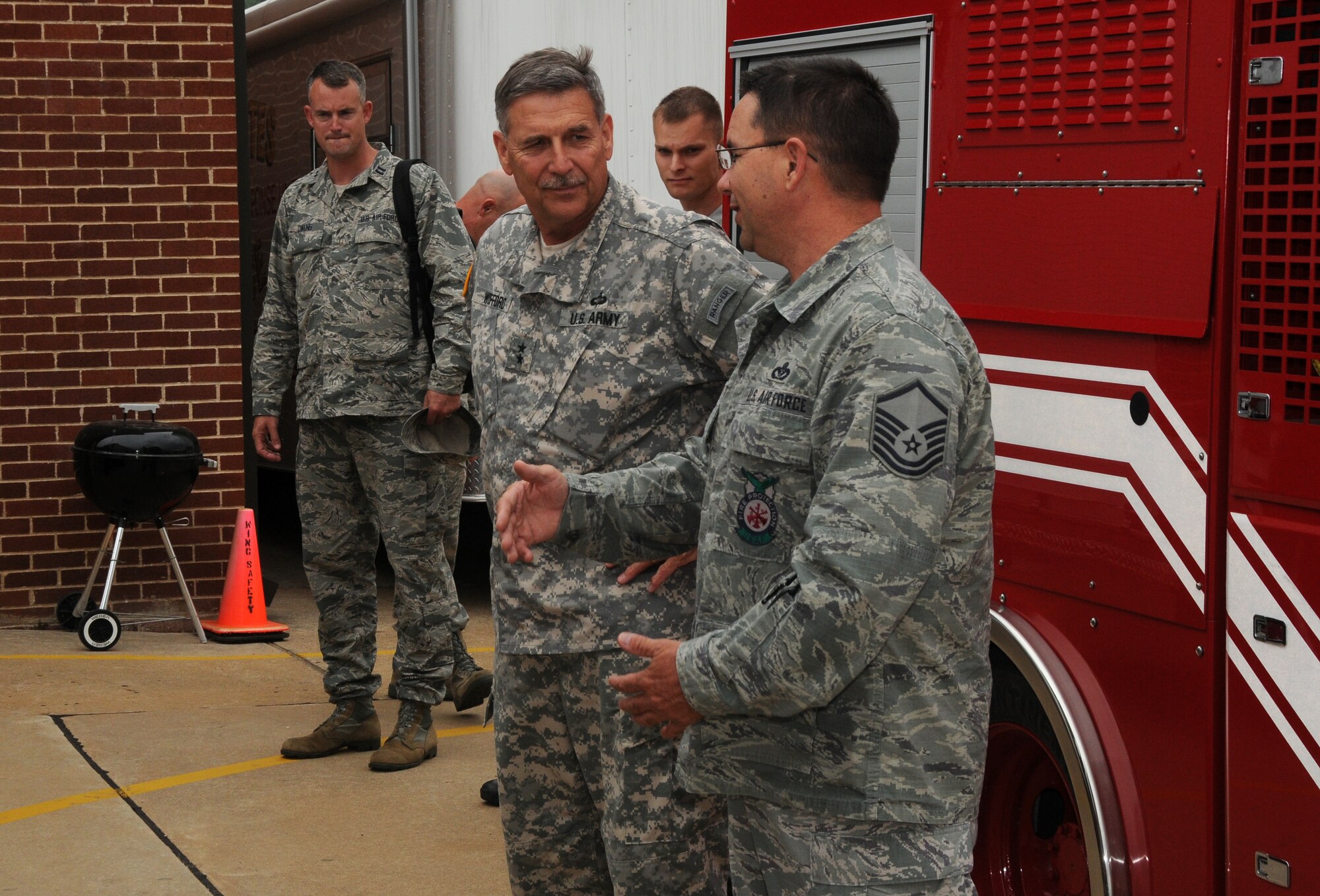 Maj. Gen. William Wofford, Arkansas National Guard adjutant general, visits with members of the 188th Fire Emergency Services Flight July 15 during a command visit to the 188th Fighter Wing. (U.S. Air National Guard photo by Senior Airman John Hillier/188th Fighter Wing Public Affairs)