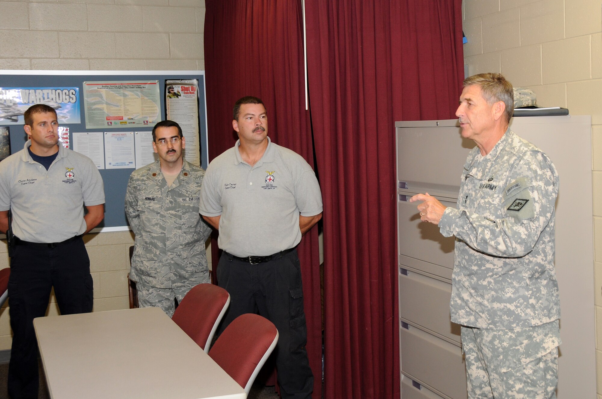Maj. Gen. William Wofford, Arkansas National Guard adjutant general, visits with members of the 188th Fire Emergency Services Flight July 15 during a command visit to the 188th Fighter Wing. (U.S. Air National Guard photo by Senior Airman John Hillier/188th Fighter Wing Public Affairs)