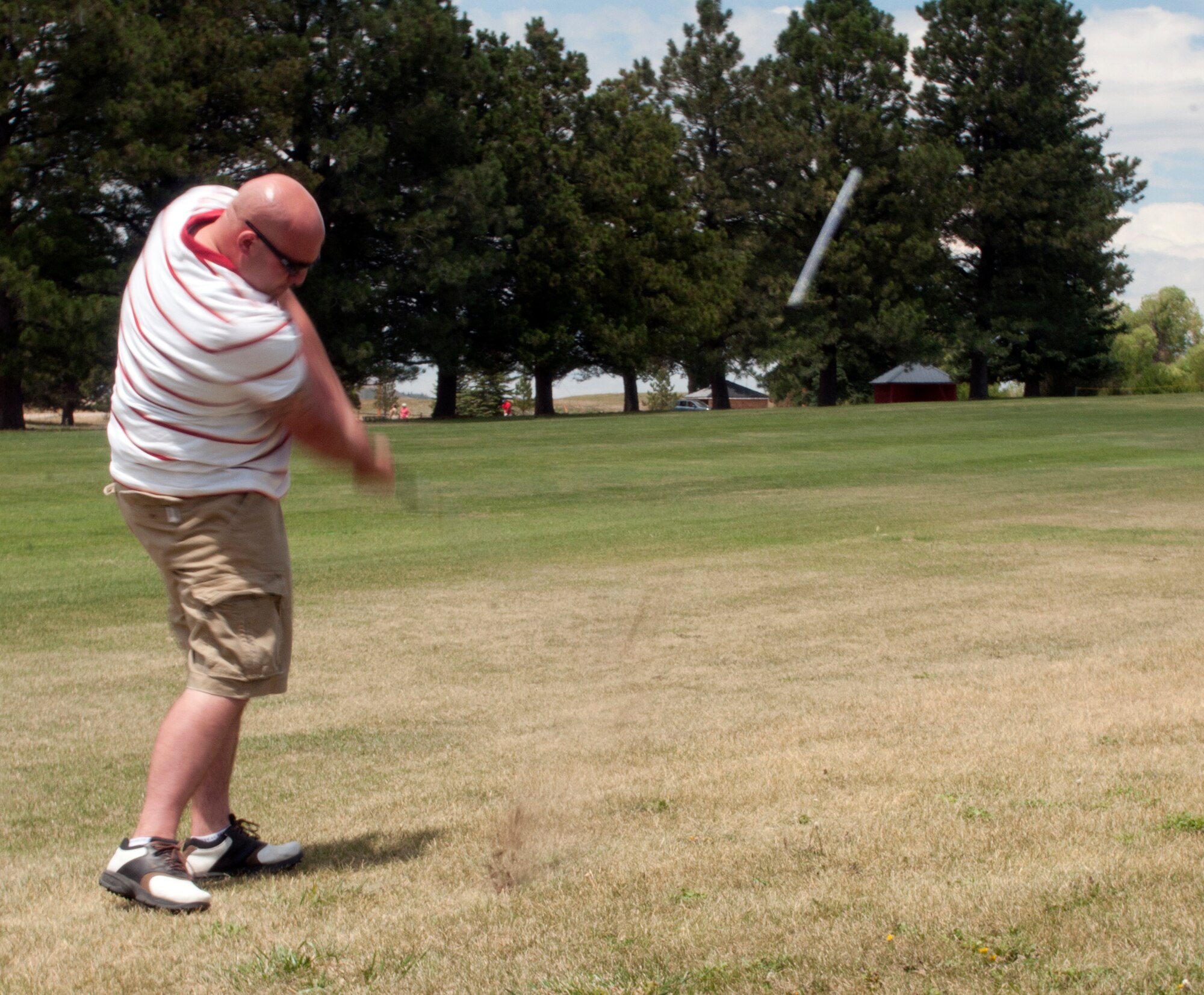 Tech. Sgt. Kevin Simmons, 90th Security Forces Group Tactical Response Force, drives the ball down the fairway of Hole 4 during the 2013 Military Affairs Committee Golf Scrambler Tournament July 12, 2013. According to Jim Wood, MAC chairman, the tournament, sponsored by the Cheyenne Chamber of Commerce Military Affairs Committee and several local businesses, was held to bring together members of local businesses and organizations and the servicemembers of Warren. (U.S. Air Force photo by Airman 1st Class Jason Wiese)