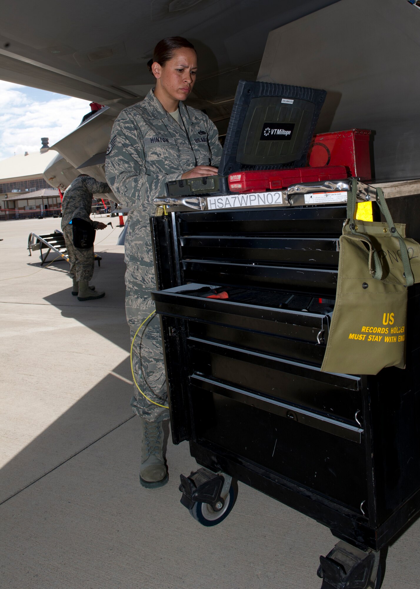 Staff Sgt. Irma Hinton, 49th Aircraft Maintenance Squadron F-22 Raptor weapons load crew member, reviews a checklist ensuring each step is followed in the correct order during the second quarter load crew competition at Holloman Air Force Base, N.M., July 19. The F-22 load crew competed against MQ-9 Reaper and German Air Force Tornado aircraft load crews. For the competition, points are awarded during the weapons loading, tool kit inspection, and uniform inspection. (U.S. Air Force photo by Senior Airman Kasey Close/Released)
