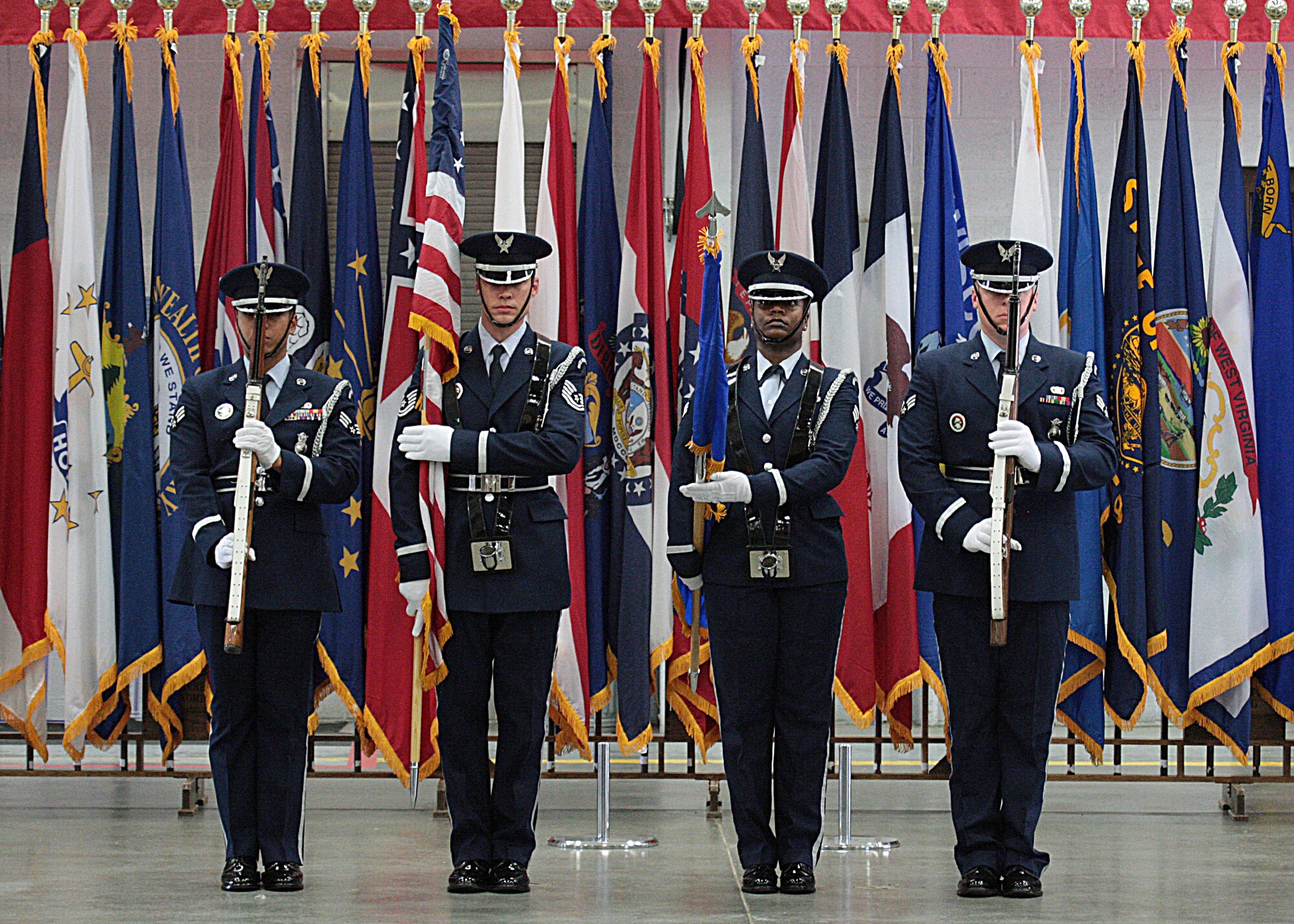 Honor Guard members post the colors during the 90th Security Forces Group change-of-command ceremony held in Bldg. 1501 July 15, 2013. (U.S. Air Force photo by Matt Bilden)