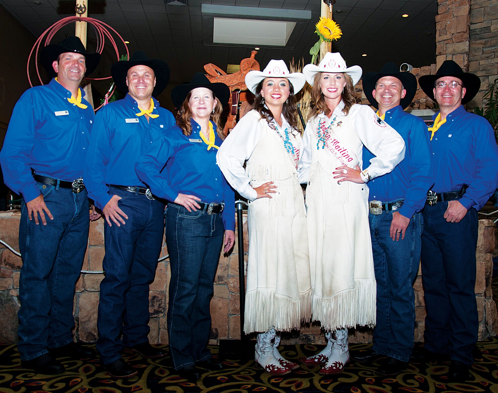Warren’s leadership poses for a photo with Chloe Pfoor, Miss Frontier, and Kaci Malmborg, her Lady-in-Waiting, at the Coronation Ball July 13, 2013. Pictured with Miss Frontier and her Lady-in-Waiting are, from left to right, Col. Trevor Flint, 90th Maintenance Group commander; Col. Travis Condon, 90th Mission Support Group commander; Col. Tracey Hayes, 90th Missile Wing commander; Col. Donnie Holloway, 90th Operations Group commander; and Col. Hans Ritschard, 90th Medical Group commander. The first Miss Frontier was crowned in 1931 and the first coronation ball was held in 1965. The military has planned and executed the annual Coronation Ball for each Miss Frontier. (U.S. Air Force photo by Tech. Sgt. Stacy Foster)