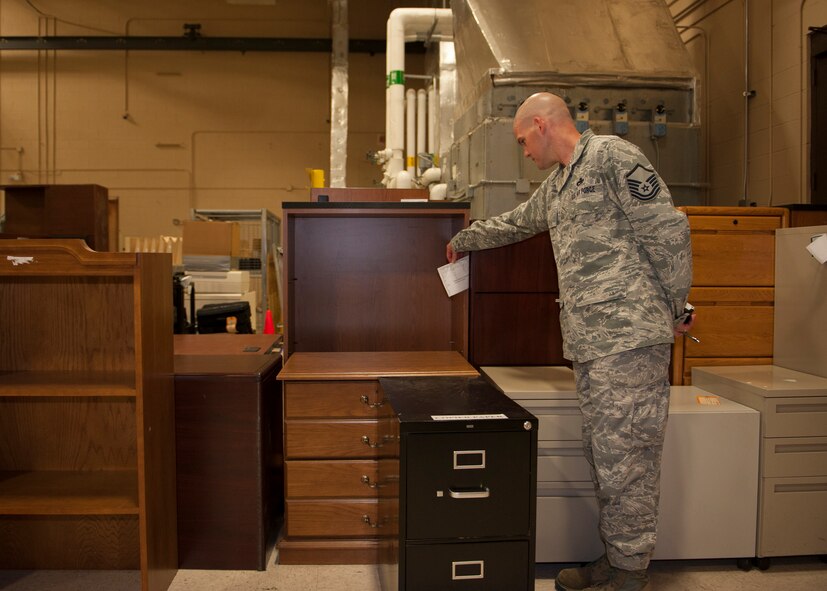 U.S. Air Force Master Sgt. Kenneth Wilkey, 23d Maintenance Group Air Force Repair Enhancement Program (AFREP) manager, reviews forms of equipment that will be made available on the 23d Logistics Readiness Squadron Repurposing SharePoint site at Moody Air Force Base, Ga., July 17, 2013. The AFREP consists of increasing the capabilities to recover, repair and reuse government equipment to financially assist the Air Force during budget cuts. (U.S. Air Force photo by Senior Airman Eileen Meier/Released)