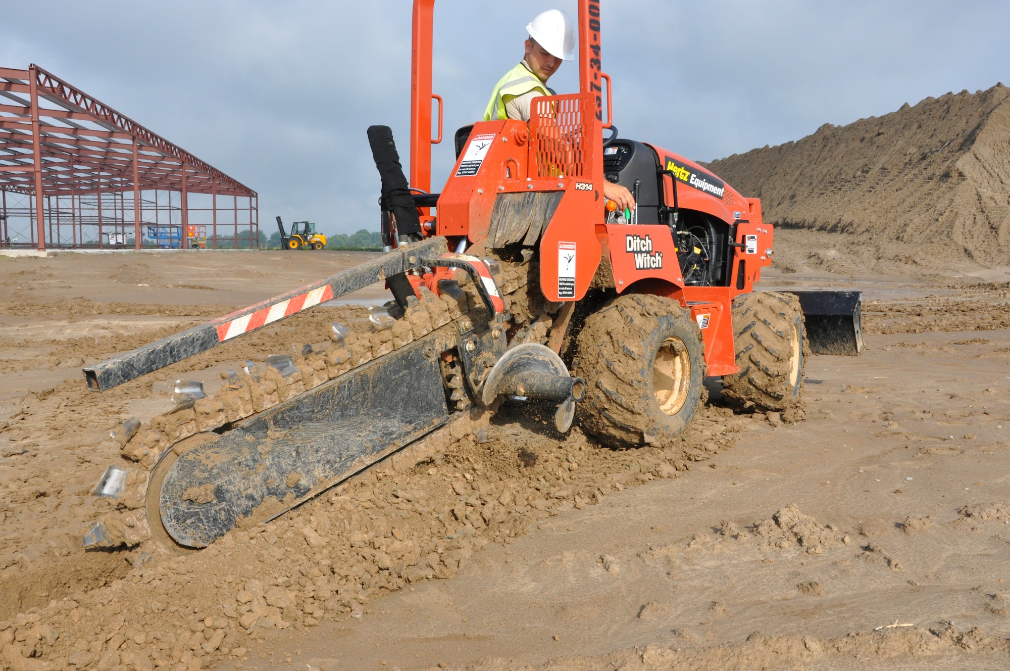 SrA Keith Montague, a utilities specialist with the 583rd RHS, operates a trencher during an IRT project at Fletcher Field, Miss.  Reservists from the newly established RED HORSE are routinely asked to operate machinery outside of their normal day-to-day duties. (U.S. Air Force Photo by Capt. Joe Simms.)