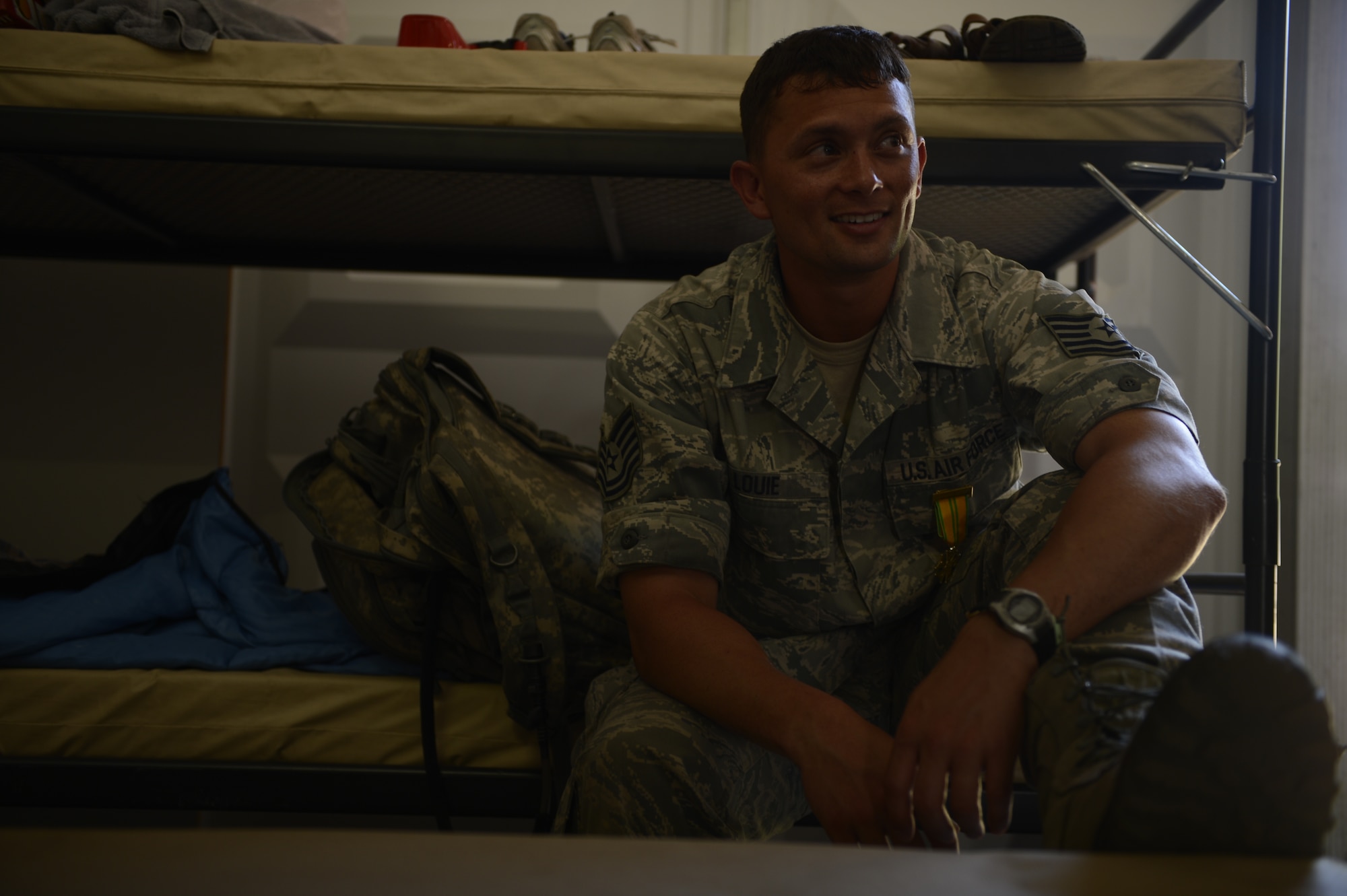 NIJMEGEN, Netherlands -- U.S. Air Force Tech. Sgt. Gabriel Louie, 52nd Logistic Readiness Squadron International Four Days Marches team member, takes a seat after completing the march July 19, 2013. (U.S. Air Force photo by Senior Airman Natasha Stannard/Released)