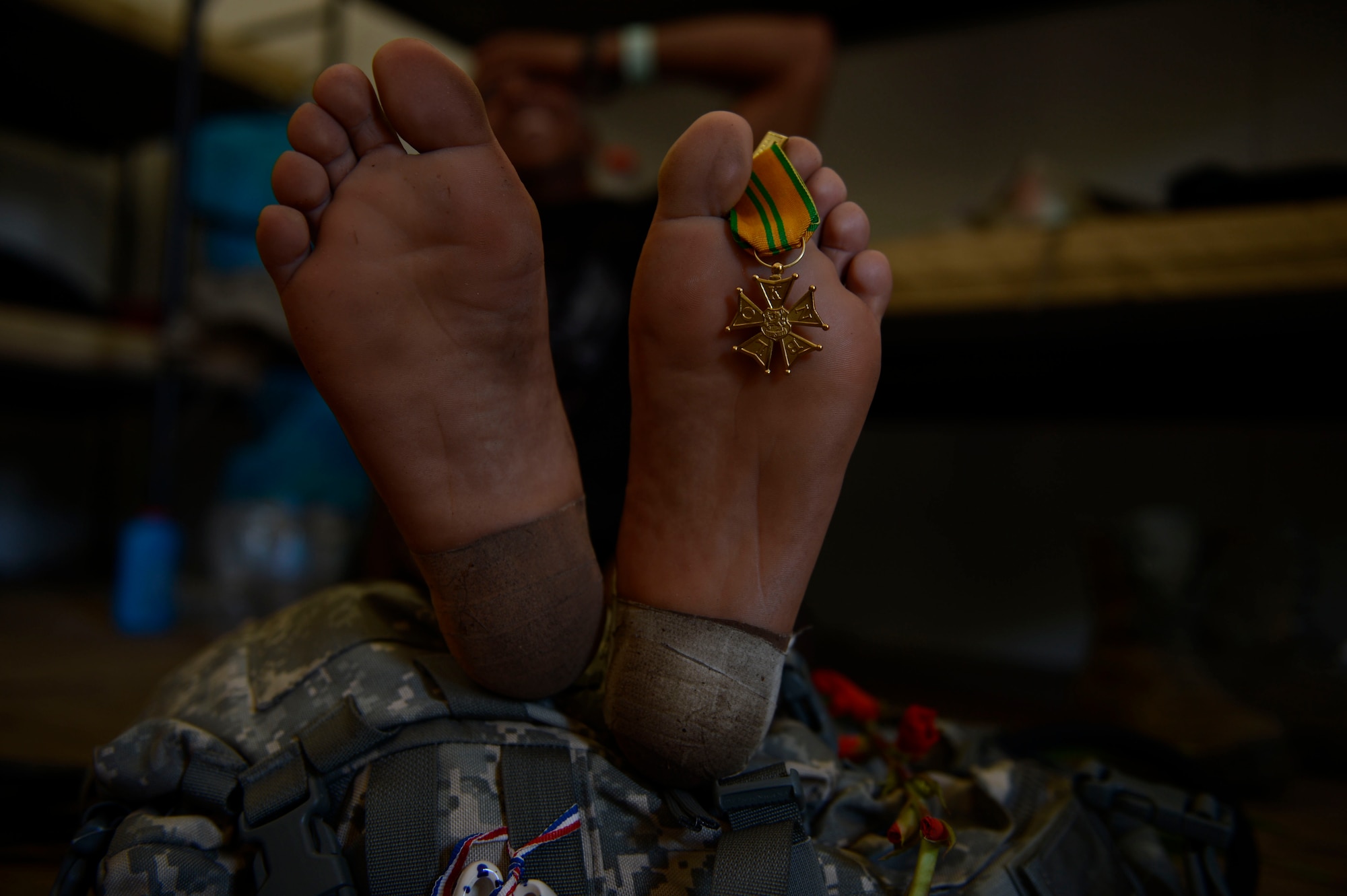 NIJMEGEN, Netherlands -- A Golden Cross medal rests on the foot of a 52nd Logistic Readiness Squadron team member during the International Four Days Marches July 19, 2013. The 52nd LRS team started with 11 members, and four members completed the 100-mile march. (U.S. Air Force photo by Senior Airman Natasha Stannard/Released)