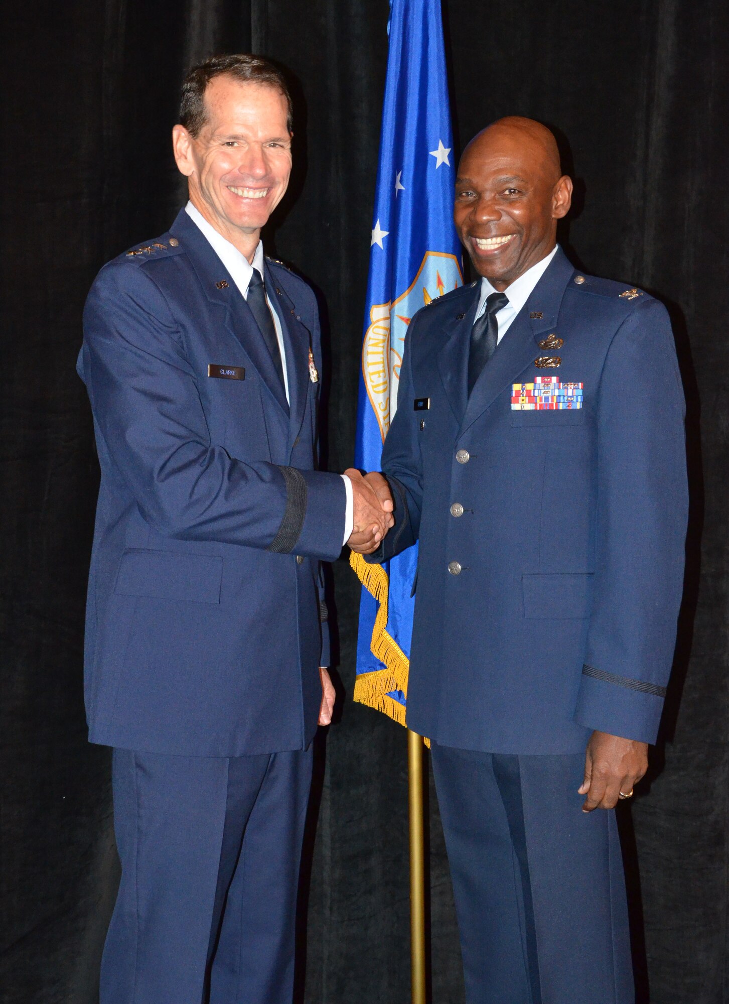 Director of the Air National Guard Lt. Gen. Stanley E. Clarke III (left) congratulates Recipient of the NAACP Meritorious Service Award, Col. Ondra Berry during an Armed Services and Veterans Affairs Awards luncheon in Orlando, Fla., July 16, 2013. Photo by Master Sgt. Thomas Kielbasa