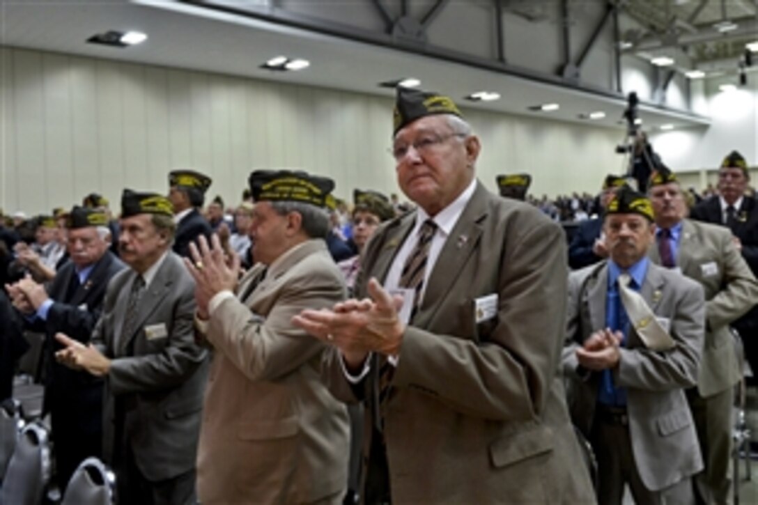 Members of the Veterans of Foreign Wars applaud after Defense Secretary Chuck Hagel delivered remarks during the VFW national convention in Louisville, Ky., July 22, 2013. 