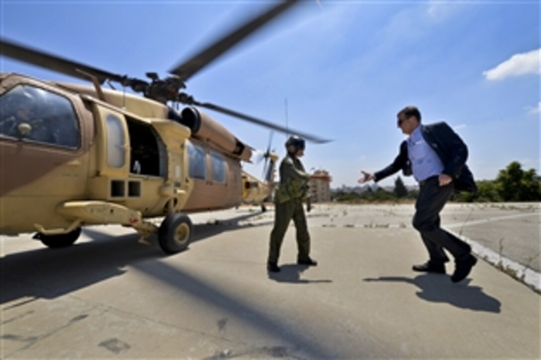 U.S. Deputy Defense Secretary Ash Carter thanks a member of the Israeli defense force after he rode in a helicopter to explore the Israeli security challenges, July 22, 2013. Carter is on a weeklong trip to meet with defense and government leaders in Israel, Uganda and Ethiopia in sub-Saharan Africa.