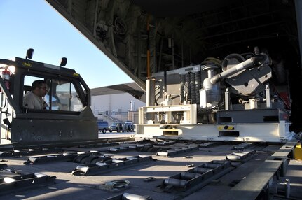 A C-130J from the California Air National Guard’s 146th Airlift Wing, Channel Islands Air National Guard Station, Calif., is loaded with part of a MAFFS system June 15 after landing at Kirtland AFB, N.M. In support of the National Interagency Fire Center, the unit brought two C-130J aircraft equipped with the Modular Airborne Fire Fighting System to help control wildfires in the Southwestern U.S. 