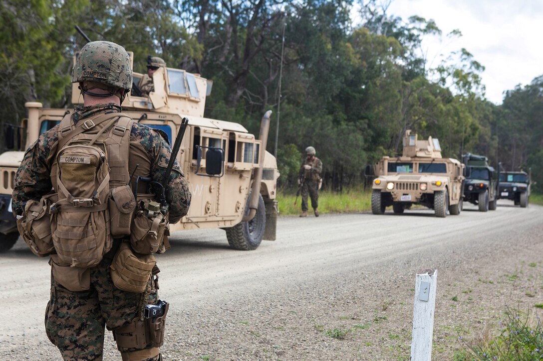 Gunnery Sgt. Jonathan M. Compton, company gunnery sergeant for Company E., Battalion Landing Team 2nd Battalion, 4th Marines, 31st Marine Expeditionary Unit, and a native of Dana Point, Calif., guides high-mobility, multi-purpose wheeled vehicles into a newly captured position following an aerial assault as a part of Talisman Saber 2013, here, July 21. The Marines and Sailors of the 31st MEU and Amphibious Squadron 11 are part of an integrated force of approximately 18,000 U.S. service members training alongside approximately 9,000 Australian service members in the fifth iteration of Talisman Saber 2013, a month-long biennial exercise designed to enhance multilateral collaboration in support of future combined operations, natural disaster, humanitarian and emergency response. The 31st MEU is the Marine Corps’ force in readiness for the Asia Pacific region and the only continuously forward-deployed MEU. 