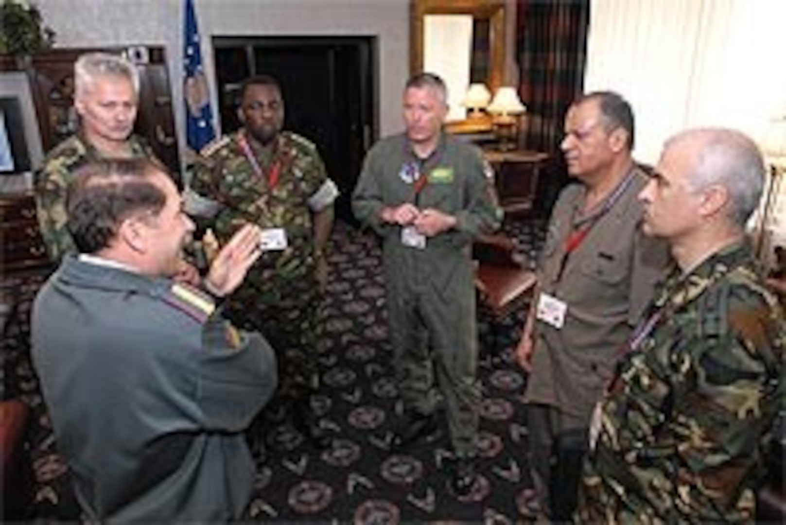 Air Force Maj. Gen. Bill Etter, director of strategic plans and policy for the National Guard Bureau, talks with attaches prior to their visit to the Muscatatuck Urban Training Center, Ind., where more than 2,000 National Guard troops and hundreds of state and federal emergency response agencies worked through the disaster scenario of a 10-kiloton nuclear explosion in Indianapolis. Attaches from Serbia, Jordan, Kenya, Tunisia, Bolivia and Hungary, walked through the stages of the exercise, receiving briefs and asking questions of those participating.