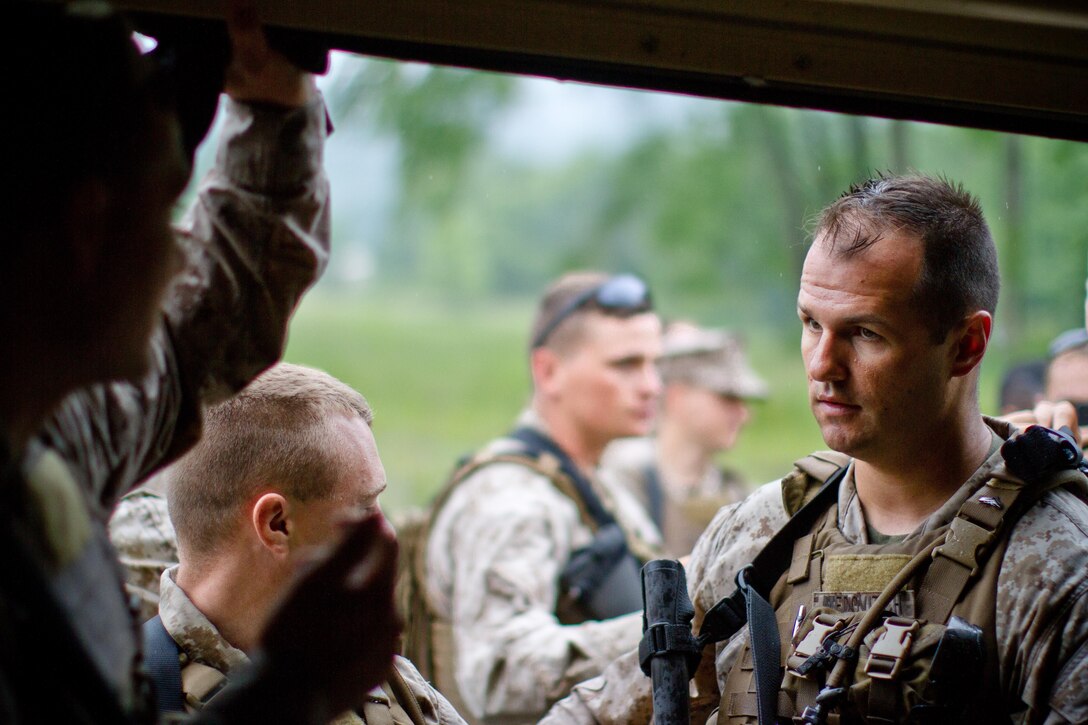 Cpl. Thomas Medovitch, a Marine with 4th LEB, North Versailles, Pa.,
gears up for a mission during training June 27 in Camp Dawson, WV. The
Marines trained with authentic Afghan role players in order to better
understand their role as a host nation advising team during an upcoming
deployment.
