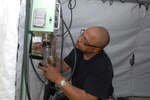 Tech. Sgt. David Betts, of the 187th Medical Group, assembles an electrical distribution panel in a field hospital in preparation for the Vigilant Guard 2008 exercise on April 19, in Beaufort, S.C. The hospital will be used by the expeditionary medical support team (EMEDS) which will practice responding to natural disasters during the 3-day National Guard exercise in Beaufort County, S.C.