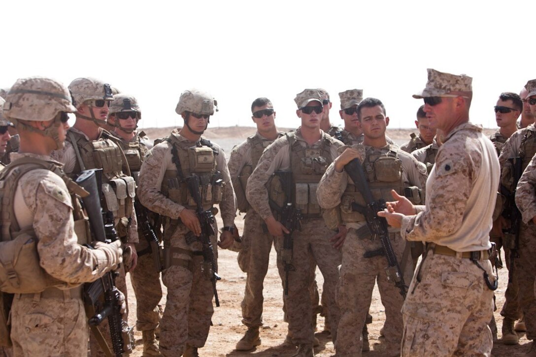 Staff Sgt. Deacon Holton, a native of Chelsea, Mich., and a section leader with 81 mm mortar section, 2nd Battalion, 8th Marine Regiment, Regimental Combat Team 7, reminds the Marines of the importance of upholding the battalion standards during training here, July 13, 2013. "This training gives us the opportunity to reinforce and refine our skill set, which in turn makes us better at doing our jobs," Holton said.