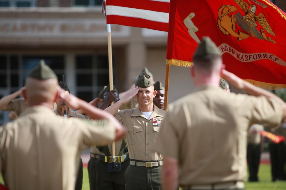 Sgt. Maj. Eric J. Kuhns, former Marine Corps Support Facility and Marine Forces Reserve Headquarters Battalion sergeant major, renders a salute during the posting of the colors at the conclusion of his retirement and relief and appointment ceremony at the MARCORSPTFAC New Orleans, July 22.  (Official Marine Corps photo by Cpl. Fenton Reese)