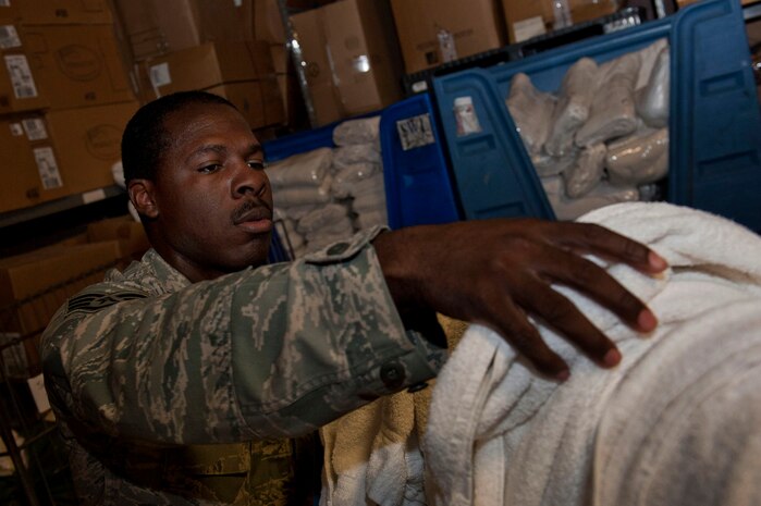 U.S. Air Force Staff Sgt. Darnell Roberts, 99th Force Support Squadron NCOIC linen exchange, counts soiled hand towels prior to cleaning July 23, 2013, at Nellis Air Force Base, Nev. Linen exchange receives all of the linen from the Nellis Inn and other lodging buildings on base and sends the laundry to the cleaners. (U.S. Air Force photo by Senior Airman Daniel Hughes