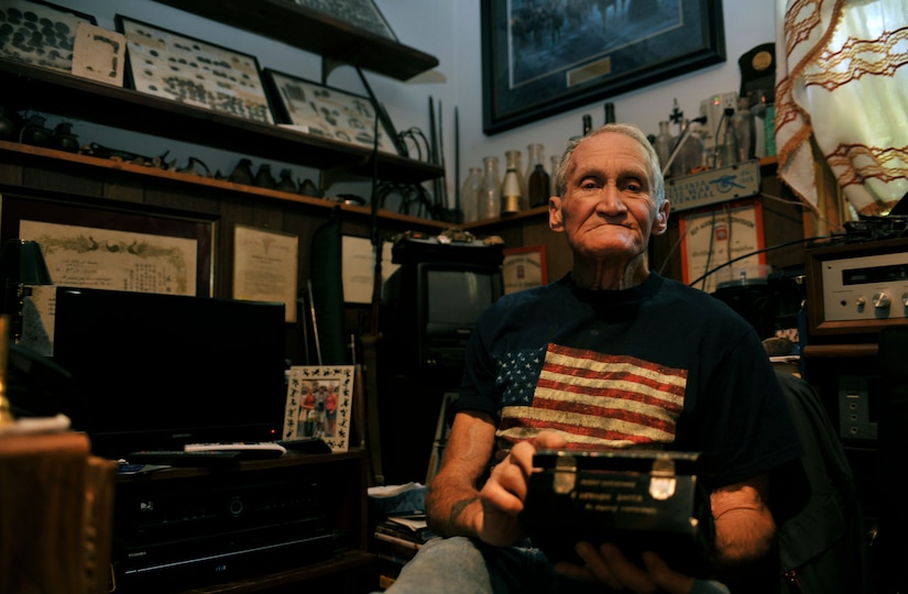 Retired U.S. Army Maj. E. Vernon Smith Jr. was stationed roughly 15 miles south of the 38th parallel in Korea in support of the Korean Armistice Agreement signed July 27, 1953, ending the war between North and South Korea. Now, 60 years later, he finds meaning in the keepsakes he received and photographs he took during his 16-month rotation, preserving memories of his experience during a significant time in military history. (U.S. Air Force photo by Staff Sgt. Katie Gar Ward/Released) 