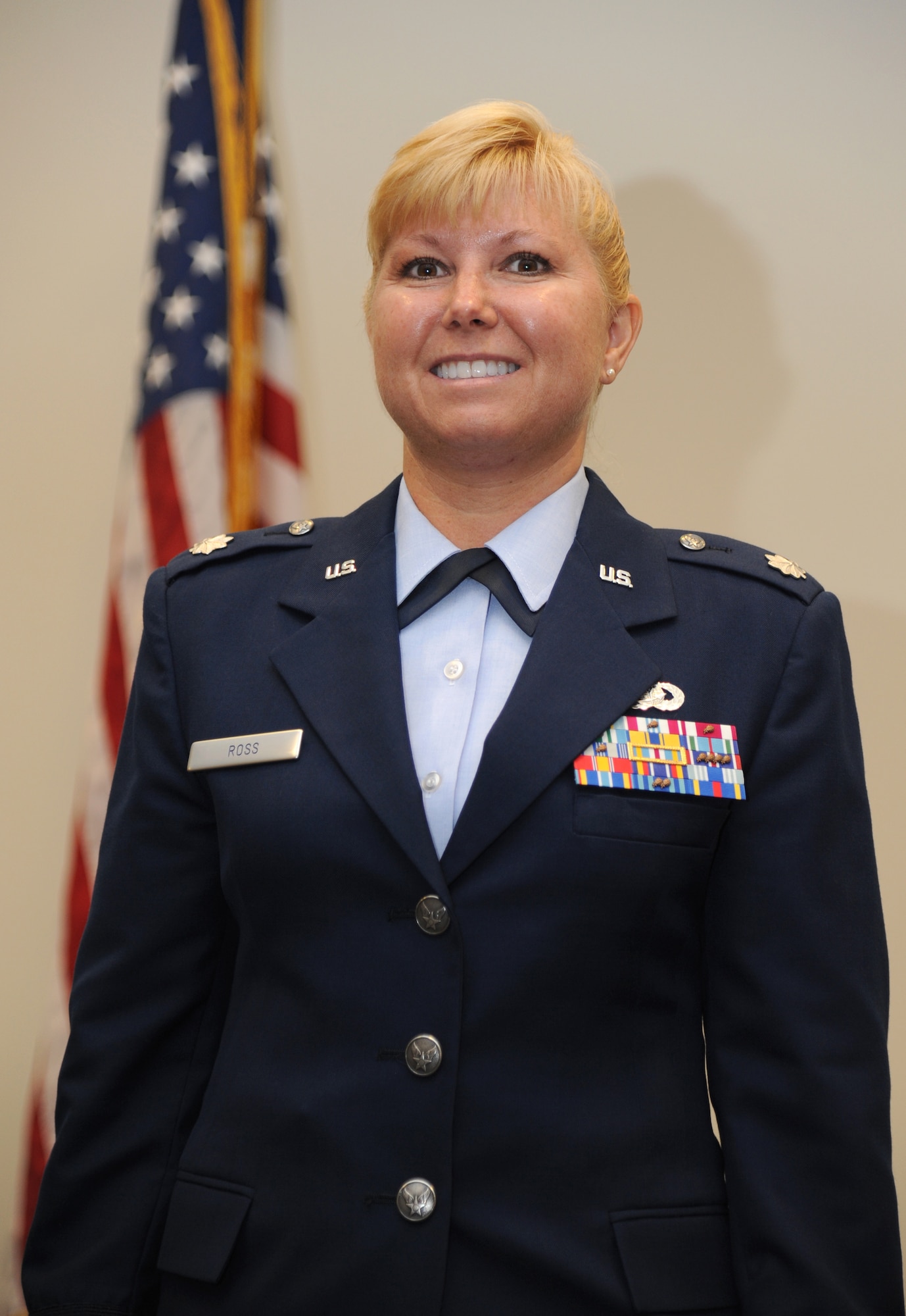 Lt. Col. Dorene Ross, incoming 335th Training Squadron commander, assumes command at the 335th TRS change of command ceremony July 22, 2013, at the Roberts Consolidated Aircraft Maintenance Facility, Keesler Air Force Base, Miss.  Col. George Tombe, 81st Training Group commander, was the officiating officer for the event and Lt. Col. Bradley McAlpine was the outgoing 335th TRS commander.  (U.S. Air Force photo by Kemberly Groue)