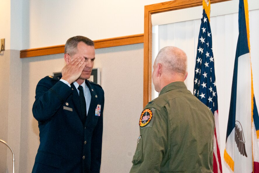 During his promotion ceremony, Lt. Col. Select Trenton Twedt (left), 132nd Maintenance Squadron Commander, 132nd Fighter Wing (132FW), Des Moines, Iowa, delivers a salute to Col. William Dehaes (right), 132nd Wing Commander,  on July 3, 2013.  (U.S. Air National Guard photo by Senior Airman Dustin M. Smart/Released)