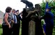 From left, Karen Mordus, President of Friends of the Fallen, Greg Wyatt, sculptor, Col. John Devillier, Air Force Mortuary Affairs Operations commander, and Col. Rick Moore, 436th Airlift Wing commander, unveil a bronze sculpture, named The Angel of the Dying Unknown at Dover Air Force Base, Del., July 22, 2013. The sculpture is located in the memorial garden near the Center for Families of the Fallen and will serve as a quiet reflection on the sacrifices made by the nation’s fallen service members. (U.S. Air Force photo by Senior Airman Melanie Bulow-Kelly/Released)