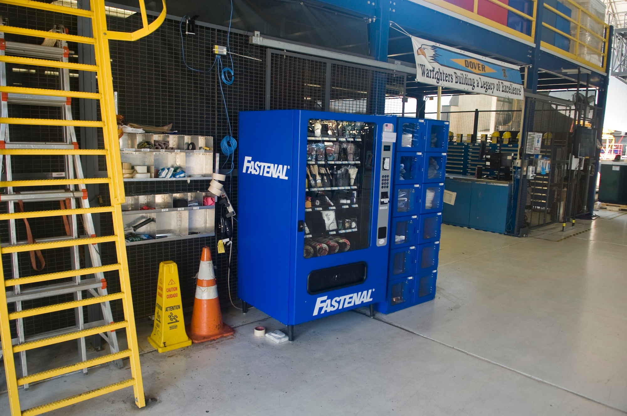 A vending machine sits in the isochronal maintenance dock July 19, 2013, at Dover Air Force Base, Del.  These vending machines are stocked with equipment commonly used by the ISO dock to speed up the time gear issued. (U.S. Air Force photo/Senior Airman Jared Duhon) 