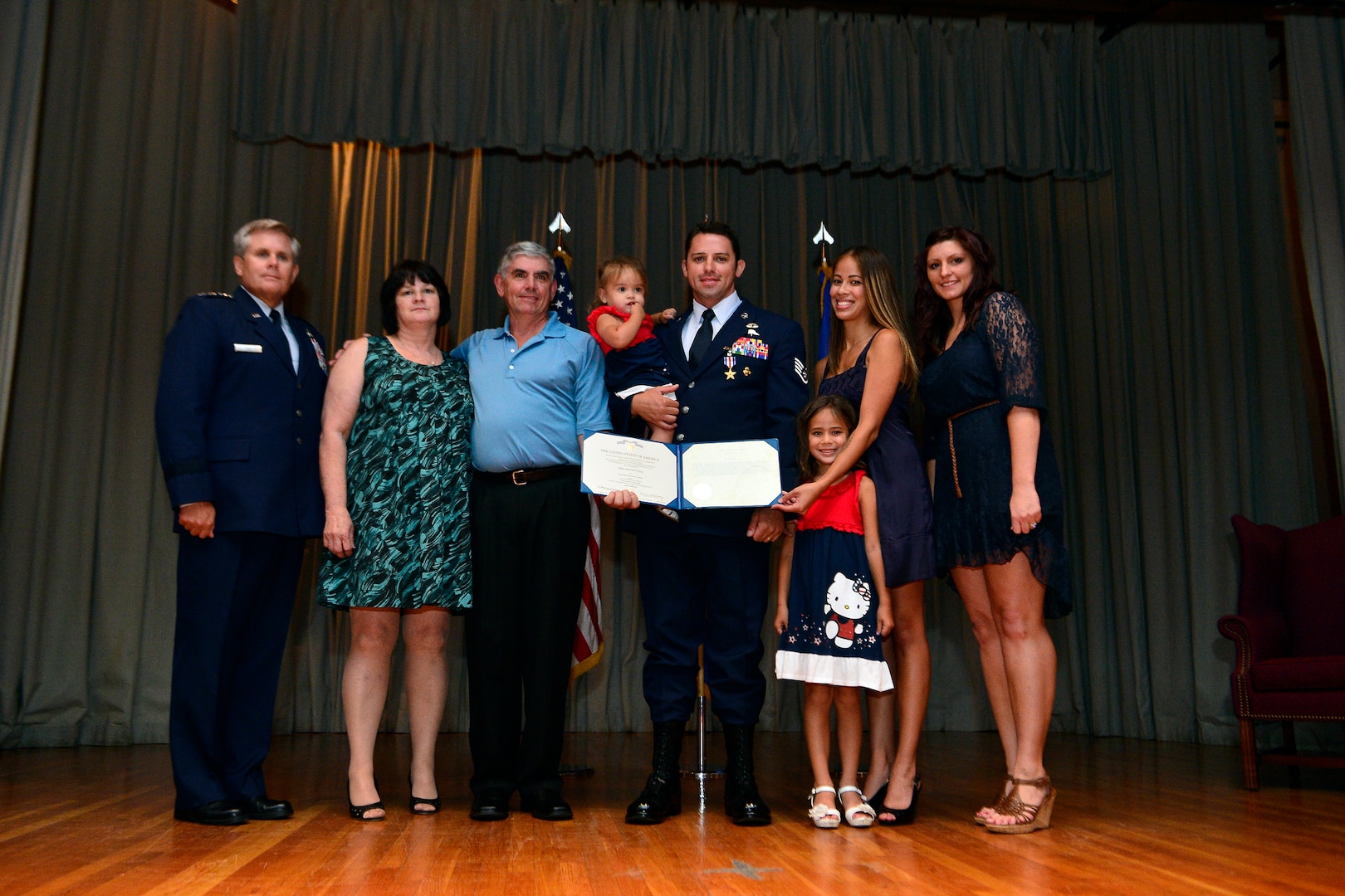 Staff Sgt. Dale Young, 342nd Training Squadron combat control instructor with his family and Lt. Gen. Eric E. Fiel, Commander, Air Force Special Operations Command (AFSOC) after receiving a Silver Star on July 22, 2013. Staff Sgt. Young was awarded the Silver Star for his actions against enemy forces in Afghanistan in 2009. (U.S. Air Force photo by Staff Sgt. Vernon Young Jr.)