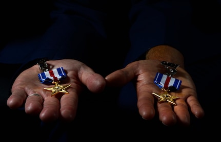 Tech. Sgt. Ismael Villegas, 24th Special Operations Wing combat control recruit liaison and Staff Sgt. Dale Young, 342nd Training Squadron combat control instructor, hold their Silver Stars after on July 22, 2013. Sergeants Villegas and Young were awarded the Silver Star for their actions against enemy forces in Afghanistan. (U.S. Air Force photo by Staff Sgt. Vernon Young Jr.)