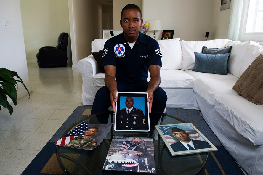 Staff Sgt. McGarry Lansiquot holds a portrait of his older brother, U.S. Army Sgt. 1st Class McGarret Lansiquot, at his home in Las Vegas, Nev., May 16, 2013. Sgt. Lansiquot and his twin brother, McGarret are both from Castries, St. Lucia, an island country located in the eastern Caribbean Sea.
(U.S. Air Force photo/Staff Sgt. Larry E. Reid Jr.)