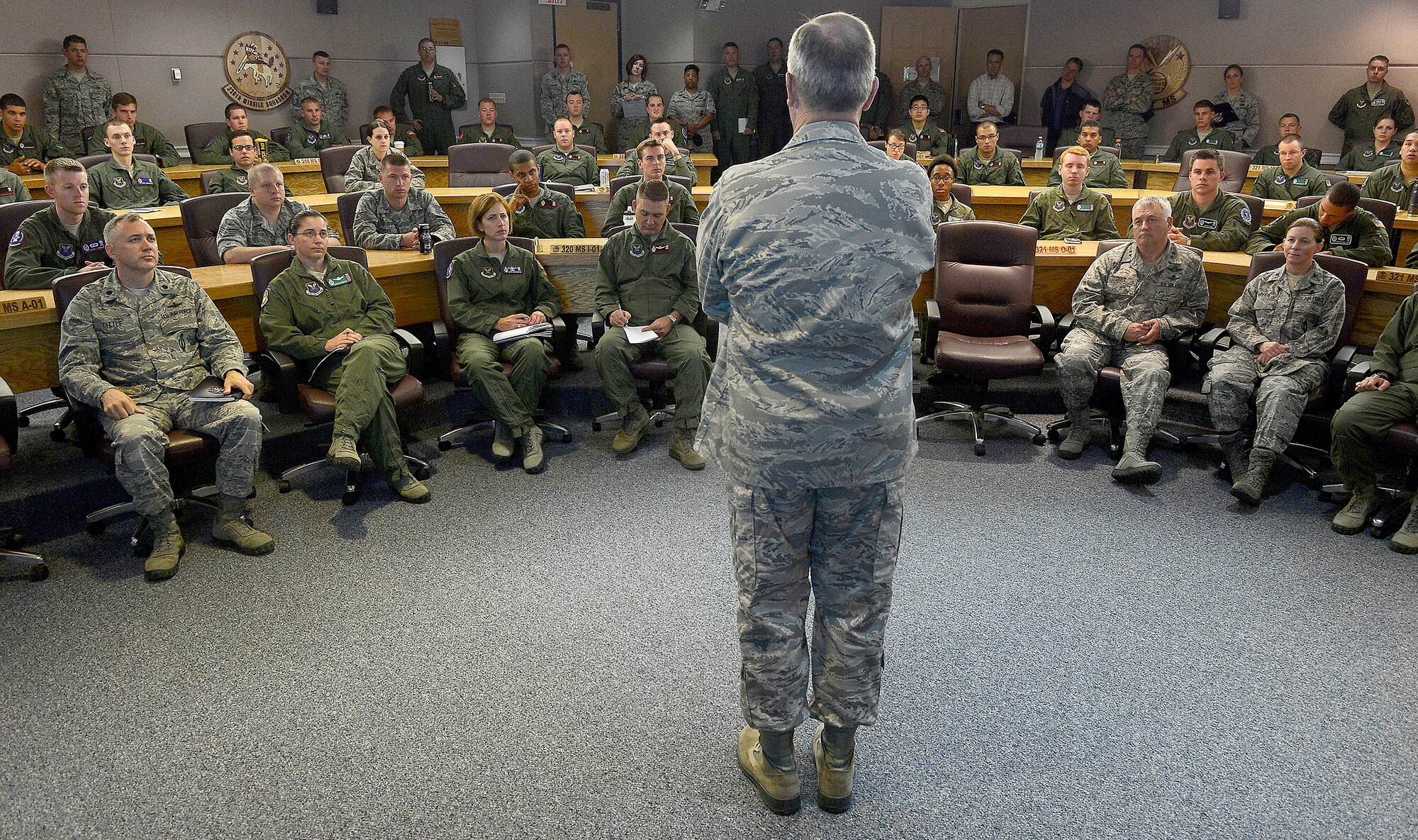 Air Force Chief of Staff Gen. Mark A. Welsh III talks with missileers from the 90th Operations Group during a pre-departure brief at F.E. Warren Air Force Base, Wyo., July 21, 2013. Welsh, along with other base leadership, joined the brief to reiterate the important role "Mighty Ninety" Airmen play in defense of the nation. He also took the time to discuss key issues impacting the service, such as sexual assault prevention, sequestration, furlough and improving communication across the service. (U.S. Air Force photo by Scott M. Ash)