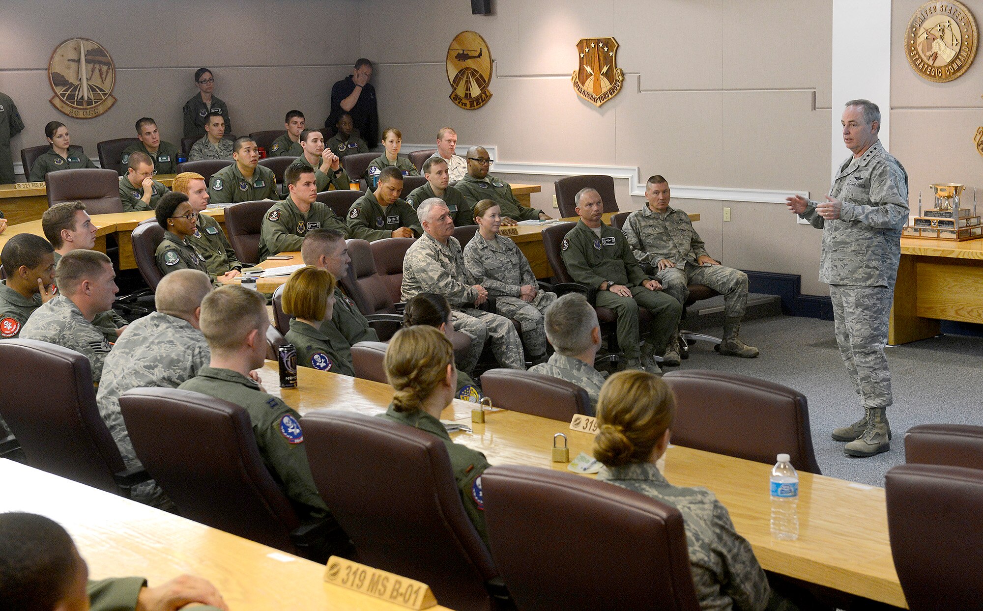 Air Force Chief of Staff Gen. Mark A. Welsh III talks with missileers from the 90th Operations Group during a pre-departure brief at F.E. Warren Air Force Base, Wyo., July 21, 2013. Welsh, along with other base leadership, joined the brief to reiterate the important role "Mighty Ninety" Airmen play in defense of the nation. He also took the time to discuss key issues impacting the service, such as sexual assault prevention, sequestration, furlough and improving communication across the service. (U.S. Air Force photo by Scott M. Ash)