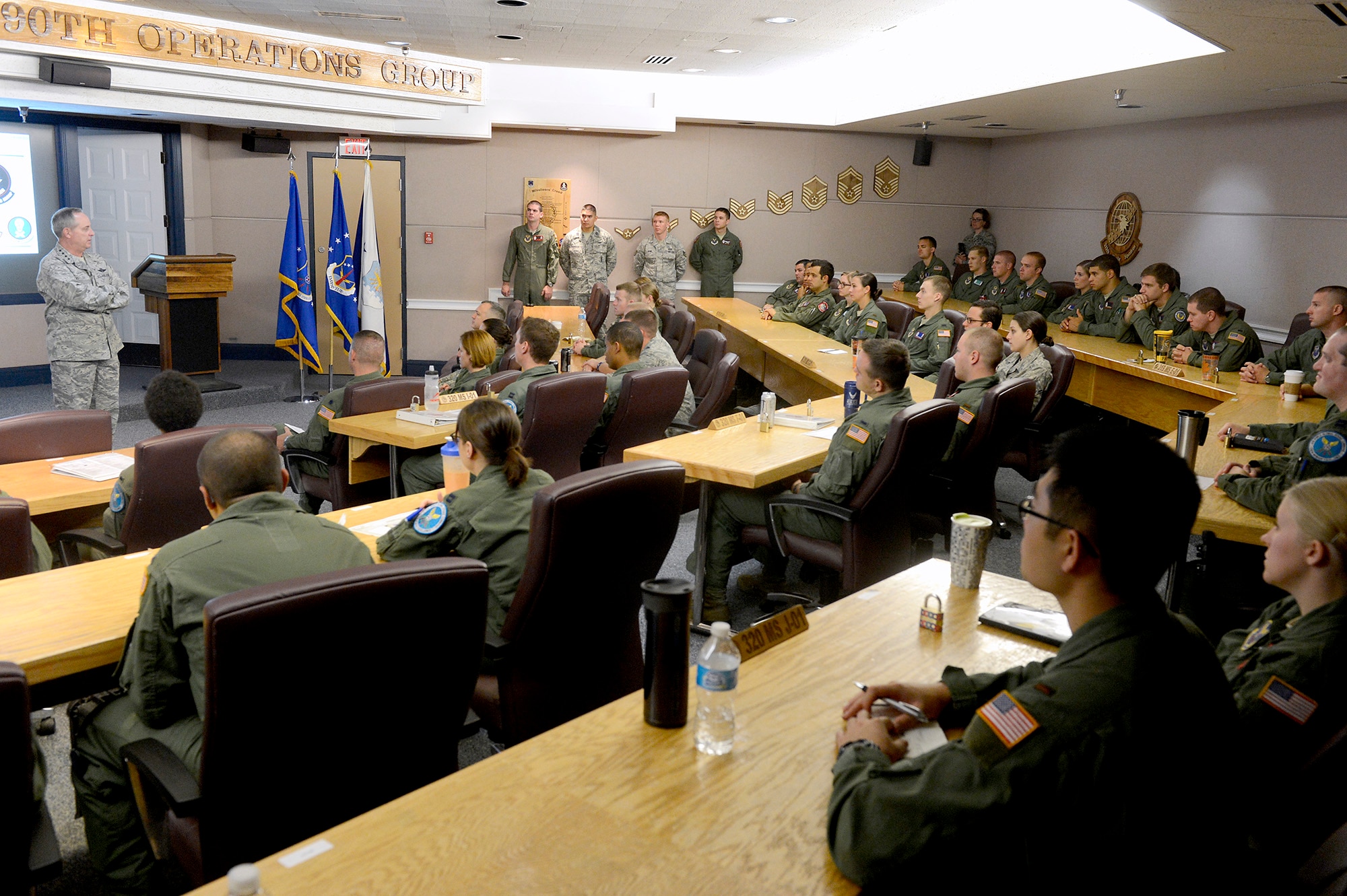 Air Force Chief of Staff Gen. Mark A. Welsh III talks with missileers from the 90th Operations Group during a pre-departure brief at F.E. Warren Air Force Base, Wyo., July 21, 2013. Welsh, along with other base leadership, joined the brief to reiterate the important role "Mighty Ninety" Airmen play in defense of the nation. He also took the time to discuss key issues impacting the service, such as sexual assault prevention, sequestration, furlough and improving communication across the service. (U.S. Air Force photo by Scott M. Ash)