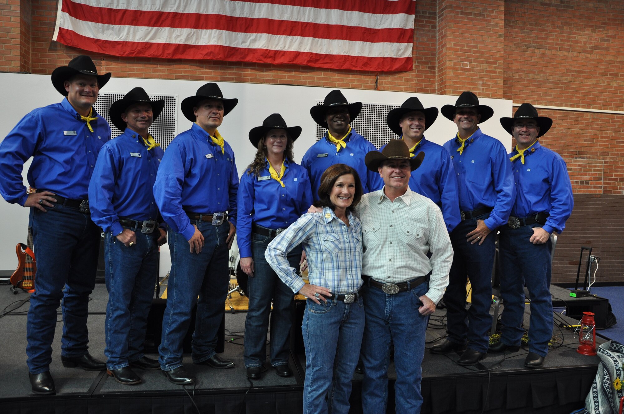 Air Force Chief of Staff Gen. Mark A. Welsh III and his wife, Betty, pose for a photograph with 90th Missile Wing leadership July 20, 2013, in the Fall Hall Community Center, F.E. Warren Air Force Base, Wyo., during the reception dinner held in his honor. Welsh, who served as grand marshal for the opening Cheyenne Frontier Days parade, visited the region to participate in rodeo events, but also to thank Airmen and the community for the continued service and support (U.S. Air Force photo by Senior Airman Mike Tryon)