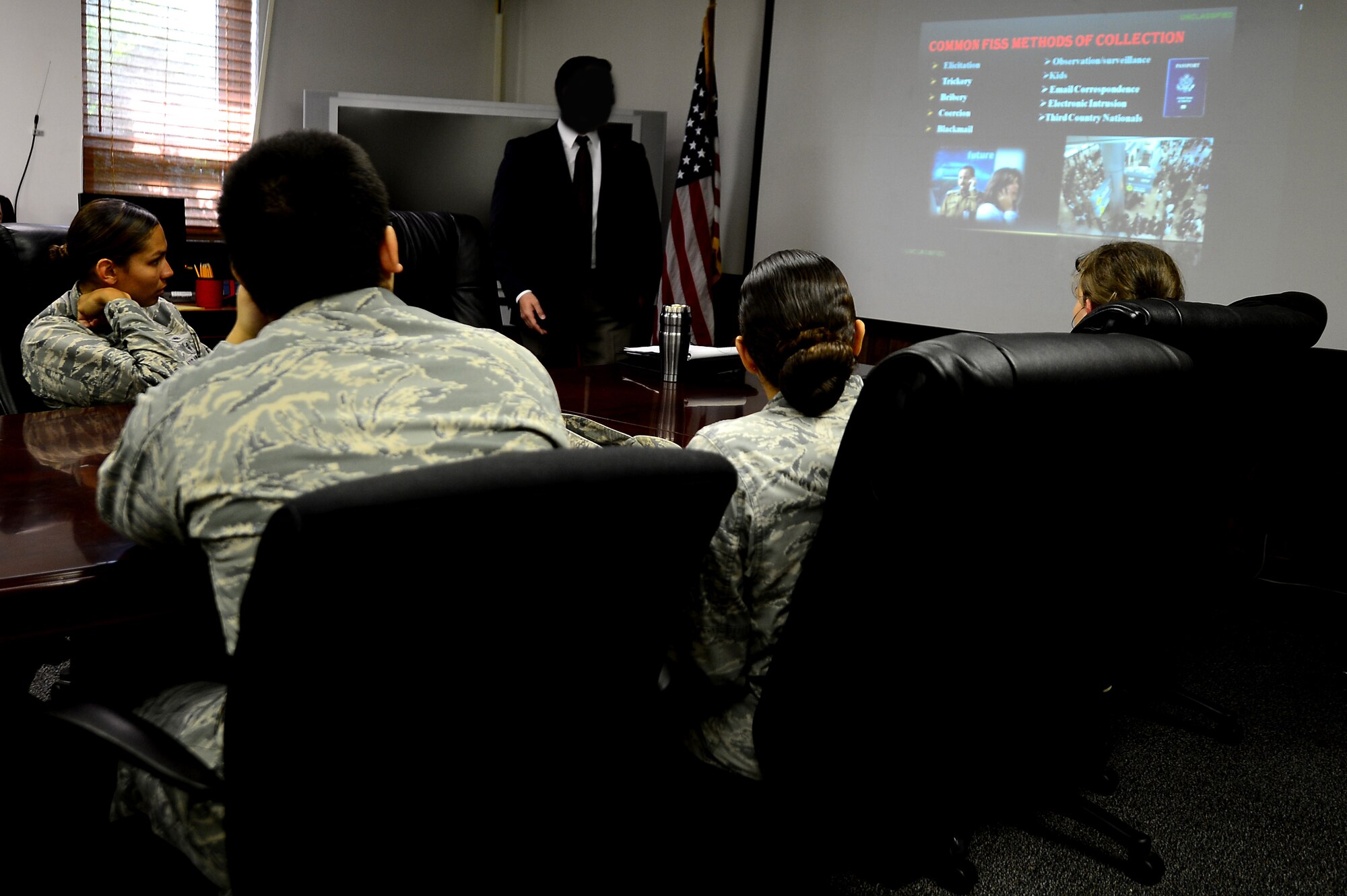 A U.S. Air Force Office of Special Investigations special agent conducts a travel briefing at Langley Air Force Base, Va., July 11, 2013. The travel briefing is mandatory for Service members and those with Department of Defense-issued security clearances who plan to travel outside of the U.S. (U.S. Air Force photo by Senior Airman Kayla Newman/Released)