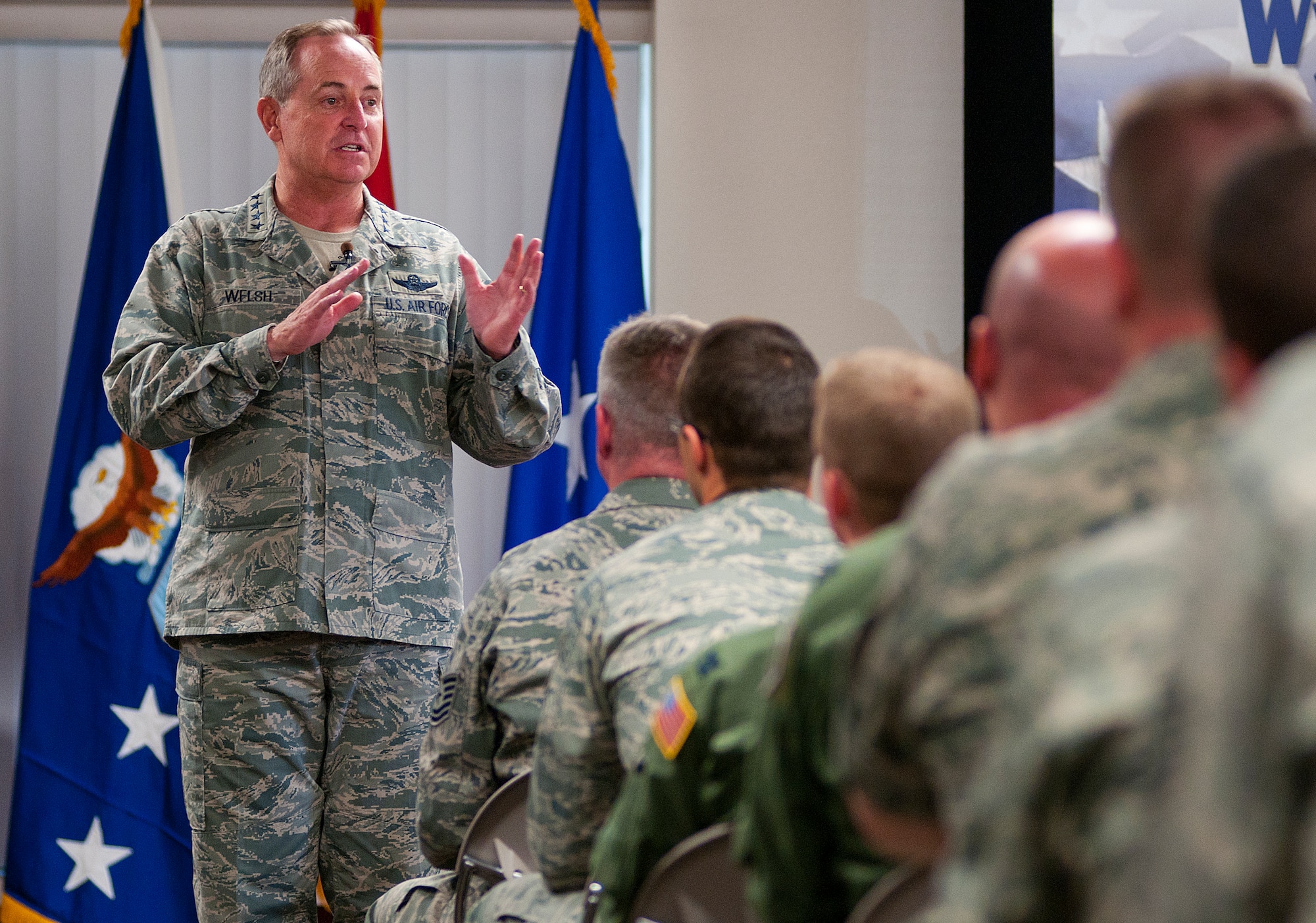 Air Force Chief of Staff Gen. Mark A. Welsh III speaks to members of the Wyoming Air National Guard after arriving at Cheyenne Regional Airport, Wyo., July 19, 2013. Welsh applauded the 153rd Airlift Wing's role in hosting the Air National Guard's first active duty associate unit, the 30th Airlift Squadron, as well as their contributions to ongoing firefighting efforts. He spoke about the important role each component plays in enabling airpower for the nation, while also addressing key issues affecting the service — like sequestration, furlough and sexual assault prevention response efforts. (U.S. Air Force photo by R.J. Oriez)