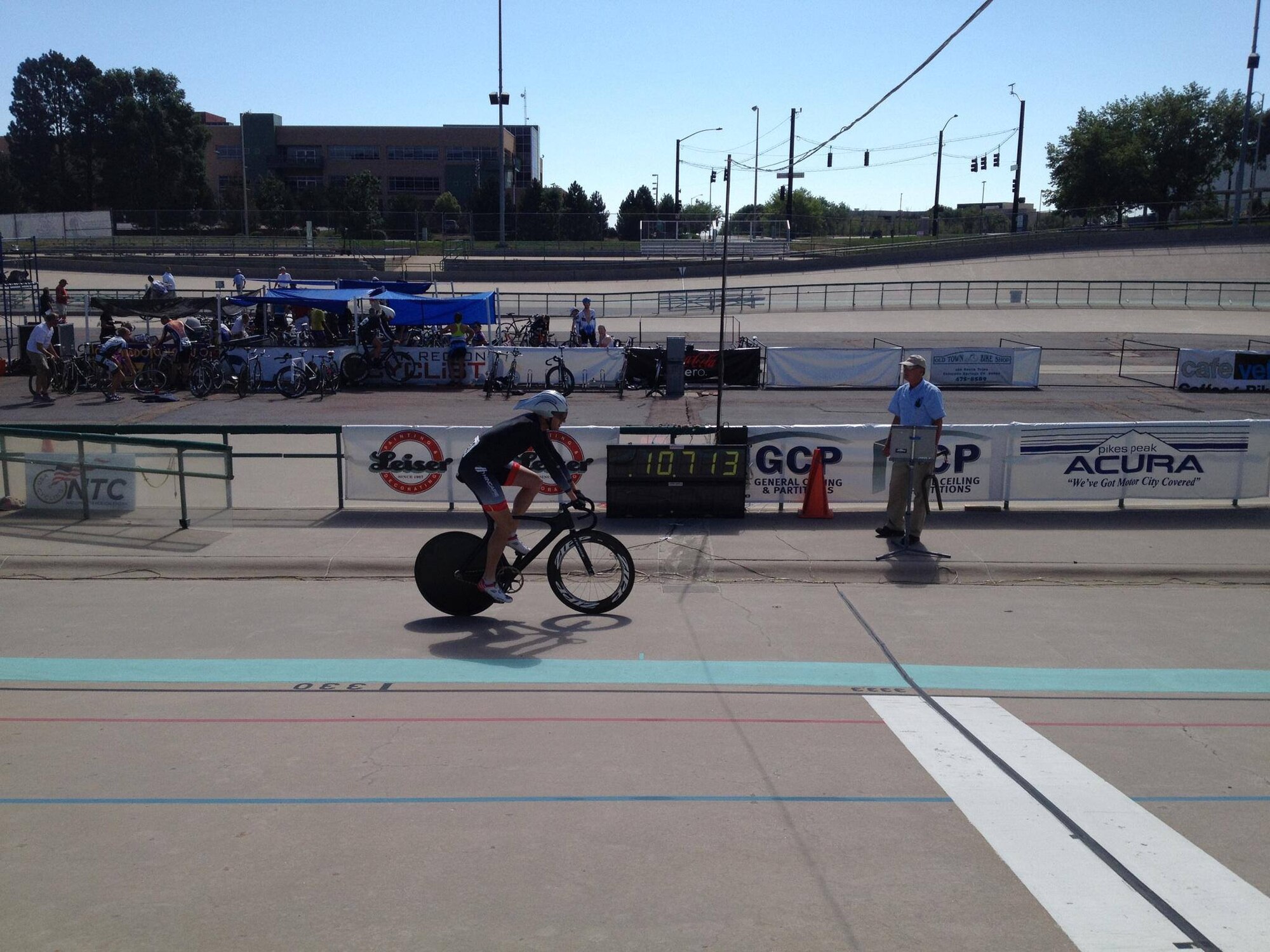 PETERSON AIR FORCE BASE, Colo. — Lt. Col. James Lawrence, a pilot with the 200th Airlift Squadron Colorado Air National Guard, pedals past the electronic time clock displaying his attempt, beating the previous world record by more than two tenths of a second. (Courtesy photo)