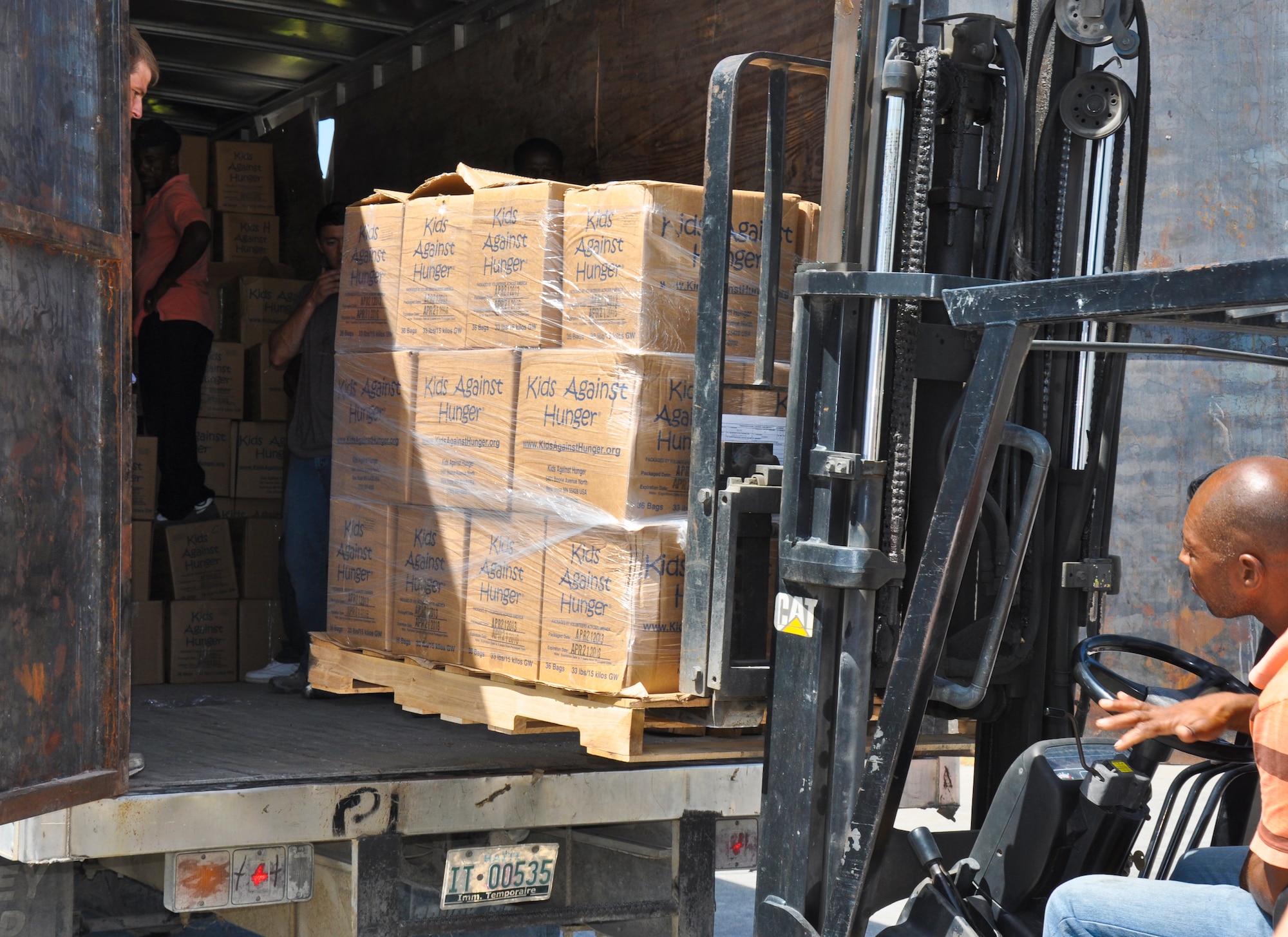 Members of the 315th Airlift Wing from Joint Base Charleston, S.C. delivered 86,200 pounds of humanitarian aid to El Salvador and Haiti on a training mission this weekend.  (U.S. Air Force photo by Maj. Wayne Capps)
