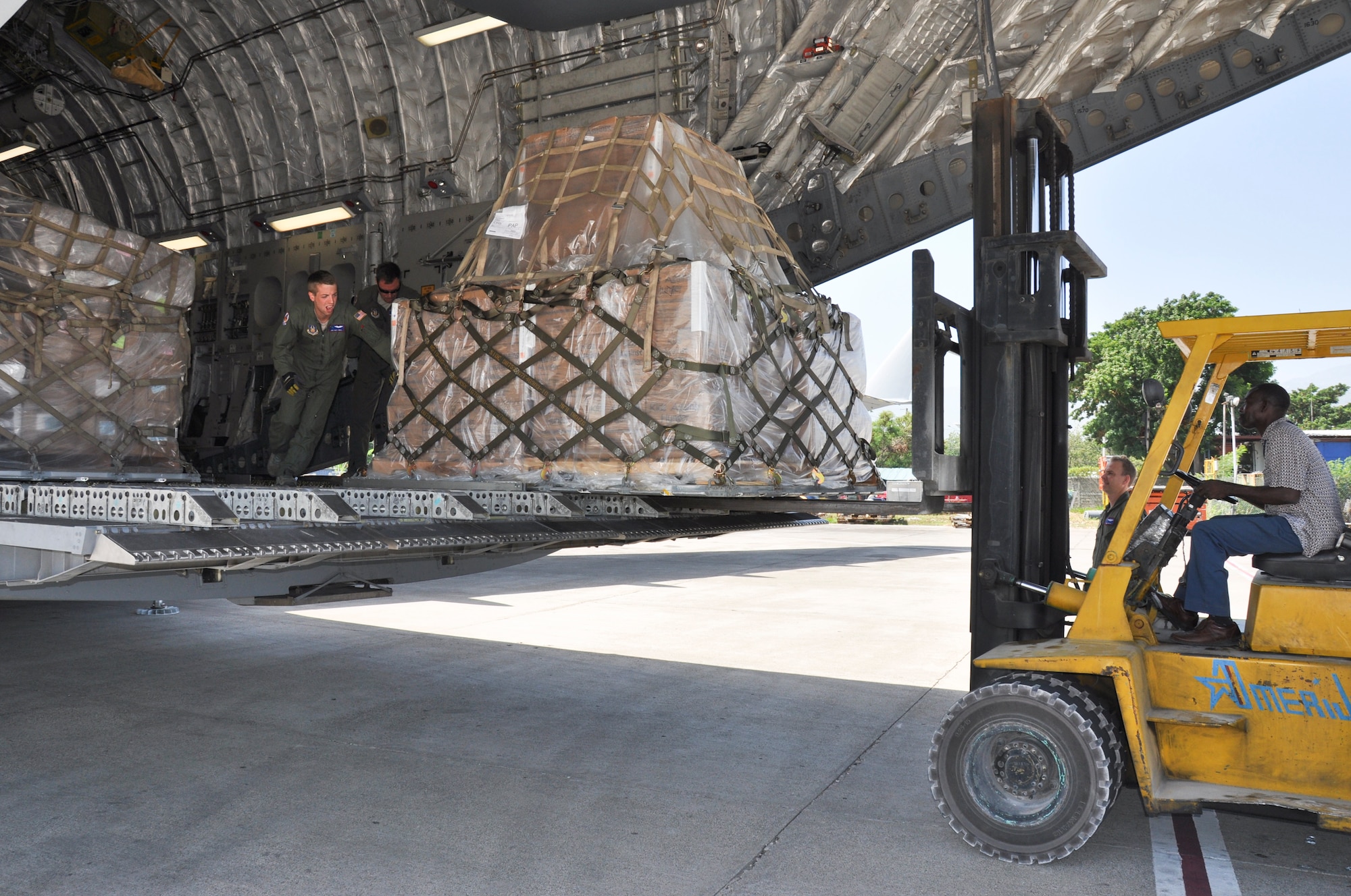 Members of the 315th Airlift Wing from Joint Base Charleston, S.C. delivered 86,200 pounds of humanitarian aid to El Salvador and Haiti on a training mission this weekend.  (U.S. Air Force photo by Maj. Wayne Capps)