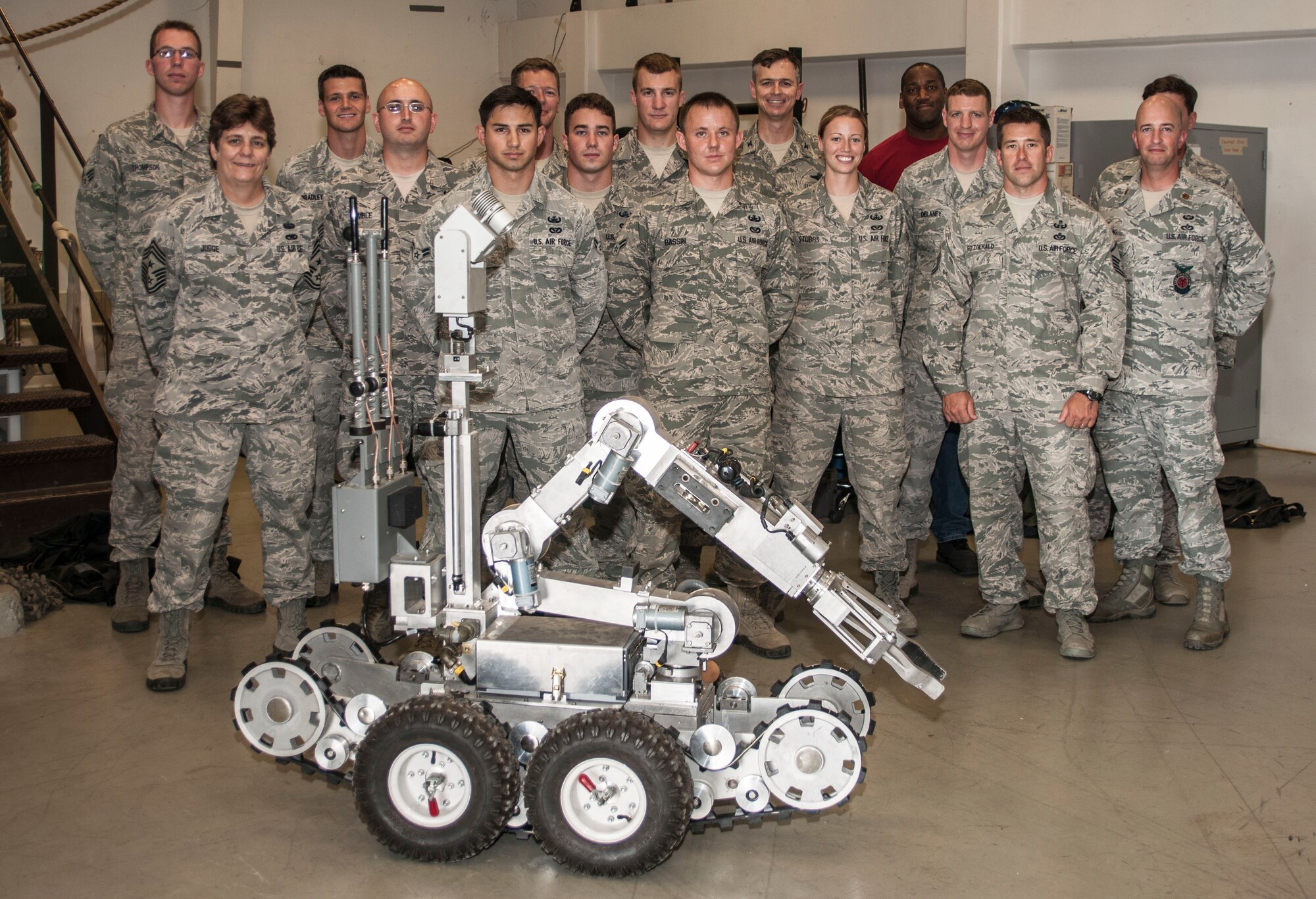 The 39th Civil Engineer Squadron explosive ordnance disposal team poses for a photo with Col. Craig Wills, 39th Air Base Wing commander, and Maj. Matthew Welling, 39th CES commander, July 18, 2013, at Incirlik Air Base, Turkey. The EOD flight gave Welling and Wills an immersion tour of their facility and capabilities. (U.S. Air Force photo by Senior Airman Anthony Sanchelli/Released)