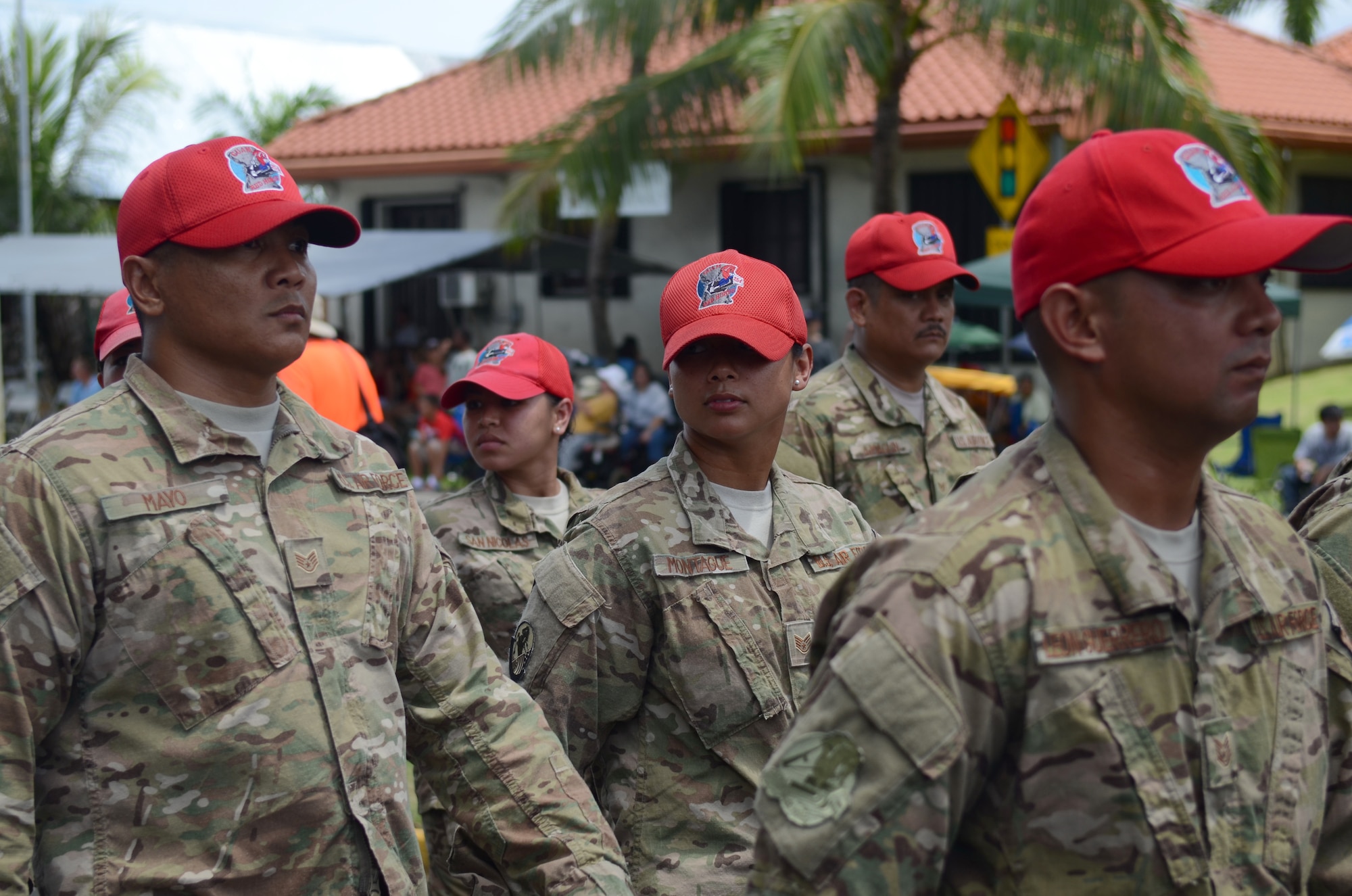 Airmen from the Guam Air National Guard’s 254th RED HORSE Squadron perform eyes right as they pass the 69th Guam Liberation Day Parade review stand in Hagåtña, Guam, July 21, 2013. Formations of active-duty service members, guardsmen and reservists, including more than 140 Airmen from the 36th Wing, led the parade down the 1.2-mile route past thousands of spectators. The parade commemorated the United States freeing the island from imperial Japan’s control during the Second Battle of Guam, which began July 21, 1944, and lasted 21 days. (U.S. Air Force photo by Staff Sgt. Brok McCarthy/Released)