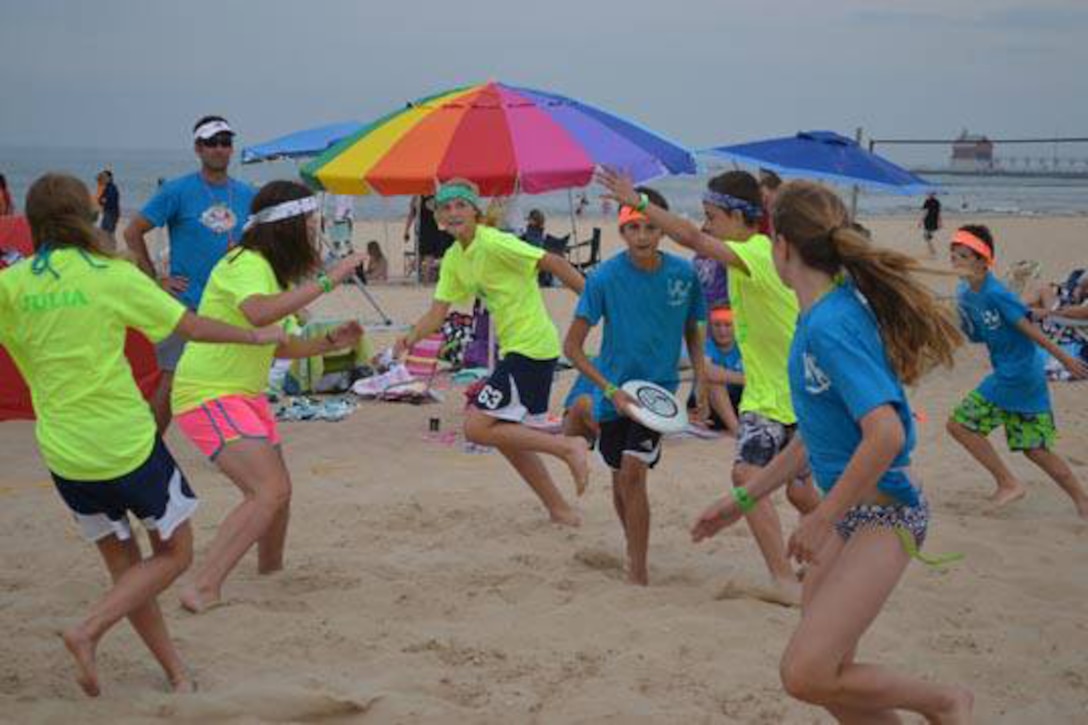 Teams compete in a game of Ultimate Frisbee during this year's Beach Survival Challenge at Grand Haven State Park.

The Beach Survival Challenge stems from a tragedy that occurred in 2002. A 17-year-old boy drowned after getting caught in a rip current in Lake Michigan, inspiring his mother to develop a fun event designed to raise awareness about rip currents and other water dangers such as pier jumping, so that swimmers may safely enjoy the beauty of Lake Michigan. 