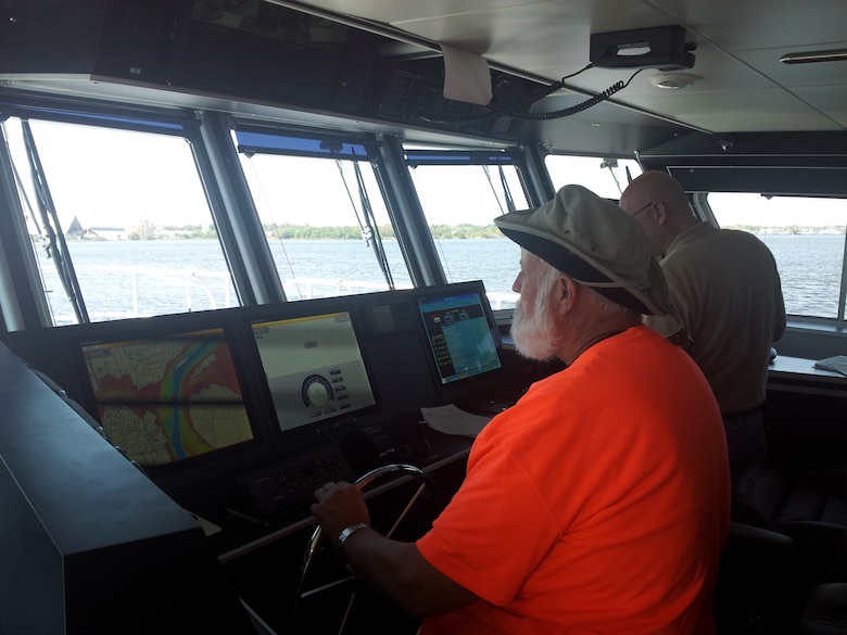 Survey technician Jack Salzer at the helm of the Florida II. Salzer was working for the Corps when the Florida first arrived in 1973