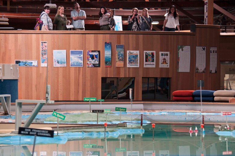 S.A.M.E. members viewing the Model. The Model is an impressive 3-D representation of the San Francisco Bay and the Delta! It is capable of simulating tides, currents, river inflows and other variables affecting water quality and movement of the Estuary. Built in 1957 by the US Army Corps of Engineers, the Bay Model spreads over 1.5 acres and is constructed with 286 five-ton concrete slabs. This one-of-a-kind facility was originally built as a scientific tool, proposed to test the impact of changes to the Bay and related waterways.